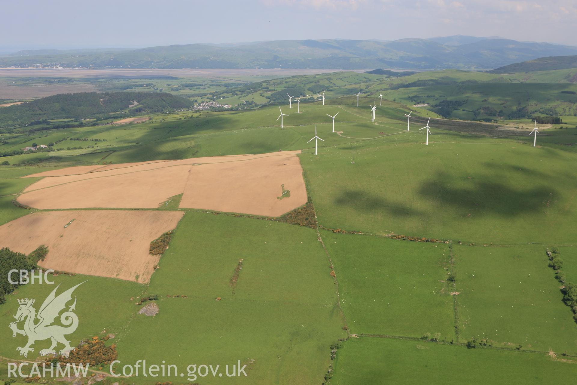 RCAHMW colour oblique aerial photograph of Mynydd Gorddu Wind Farm, Elerch, Tal-y-Bont. Taken on 02 June 2009 by Toby Driver