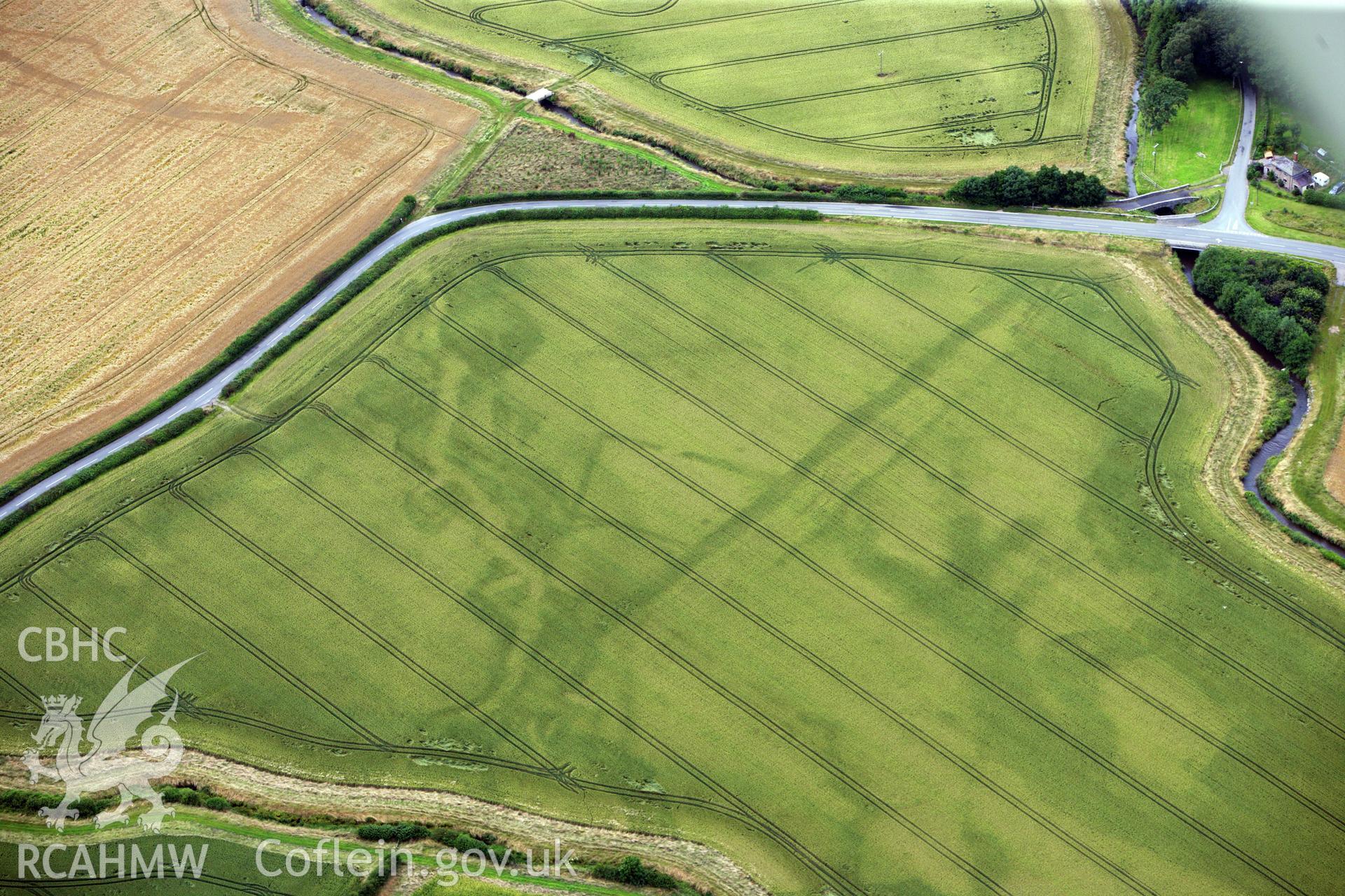 RCAHMW colour oblique aerial photograph of Ditchyeld Bridge Defended Enclosure. Taken on 23 July 2009 by Toby Driver