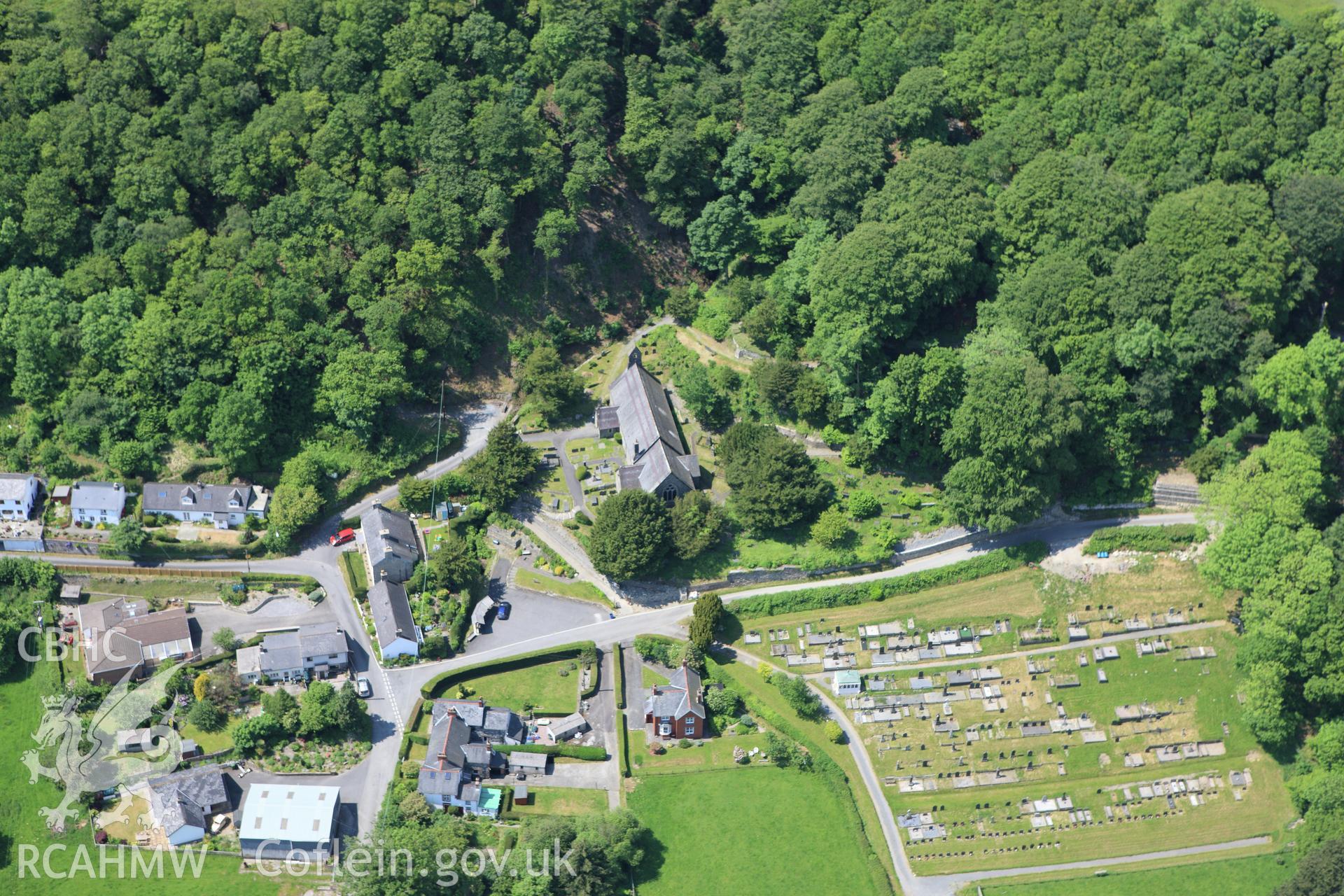 RCAHMW colour oblique aerial photograph of St Michael's Church, Llandre. Taken on 02 June 2009 by Toby Driver