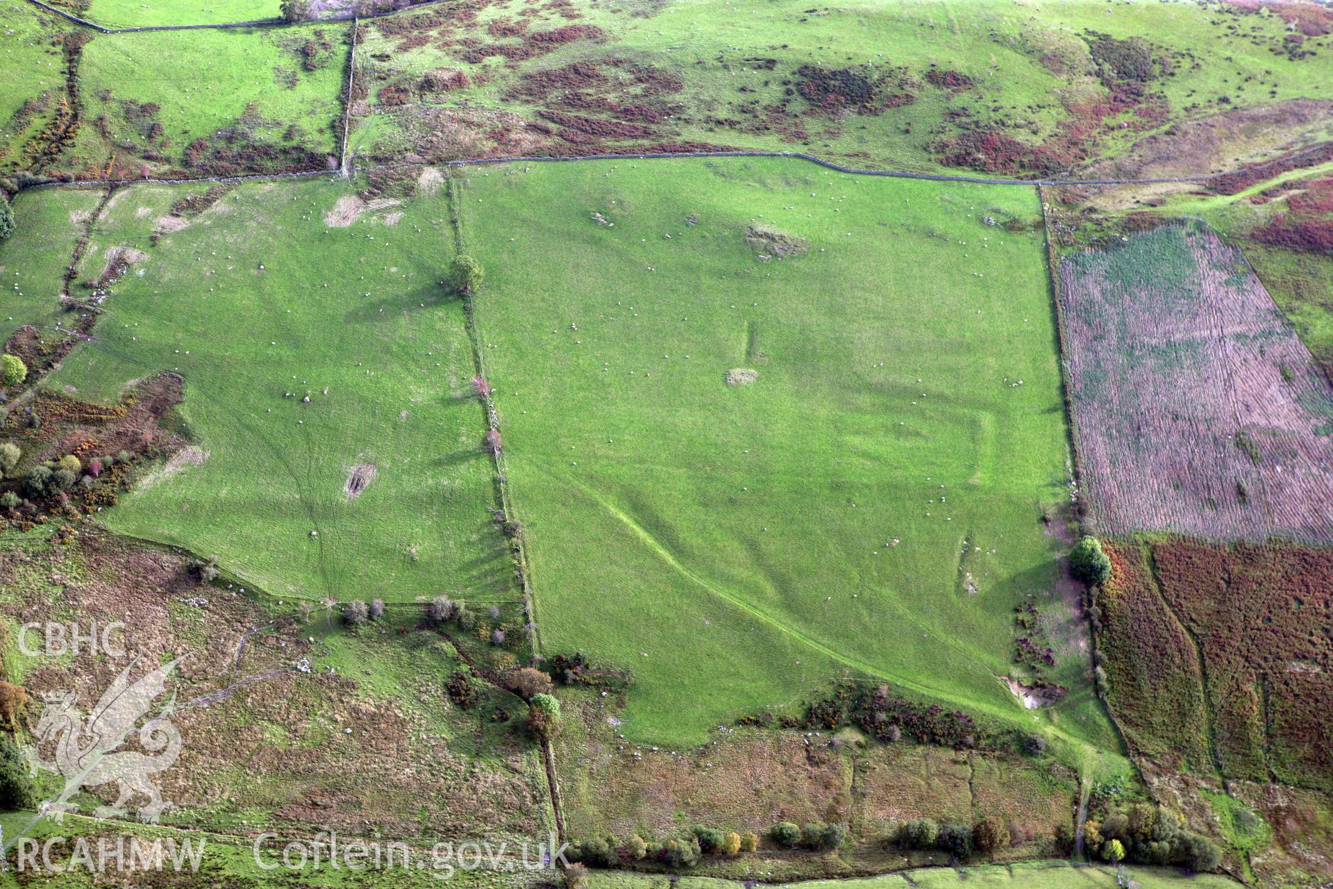 RCAHMW colour oblique aerial photograph of Caer Drewyn Settlement and Field System. Taken on 13 October 2009 by Toby Driver