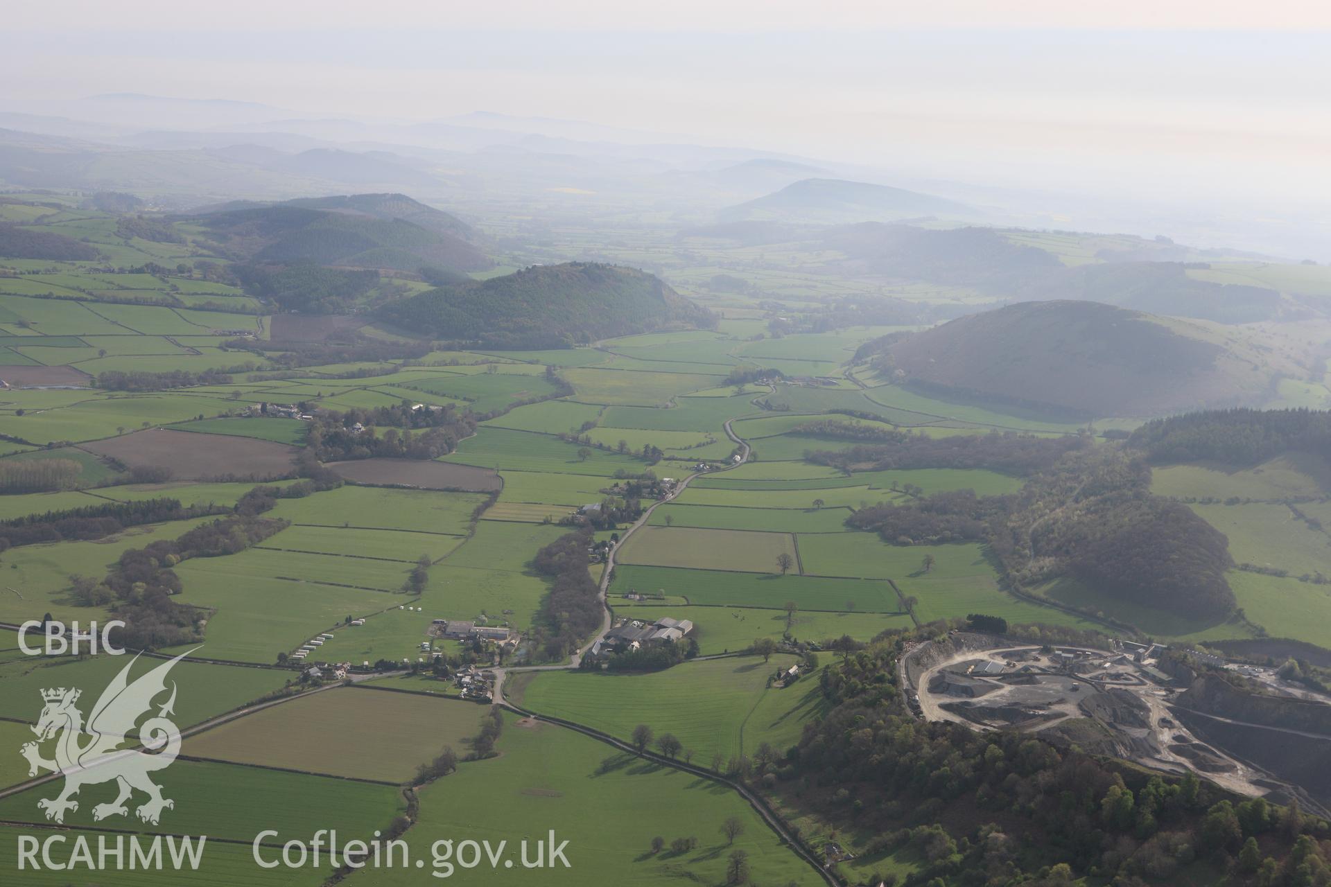 RCAHMW colour oblique aerial photograph of Walton Roman Camp II and surrounding landscape looking east. Taken on 21 April 2009 by Toby Driver