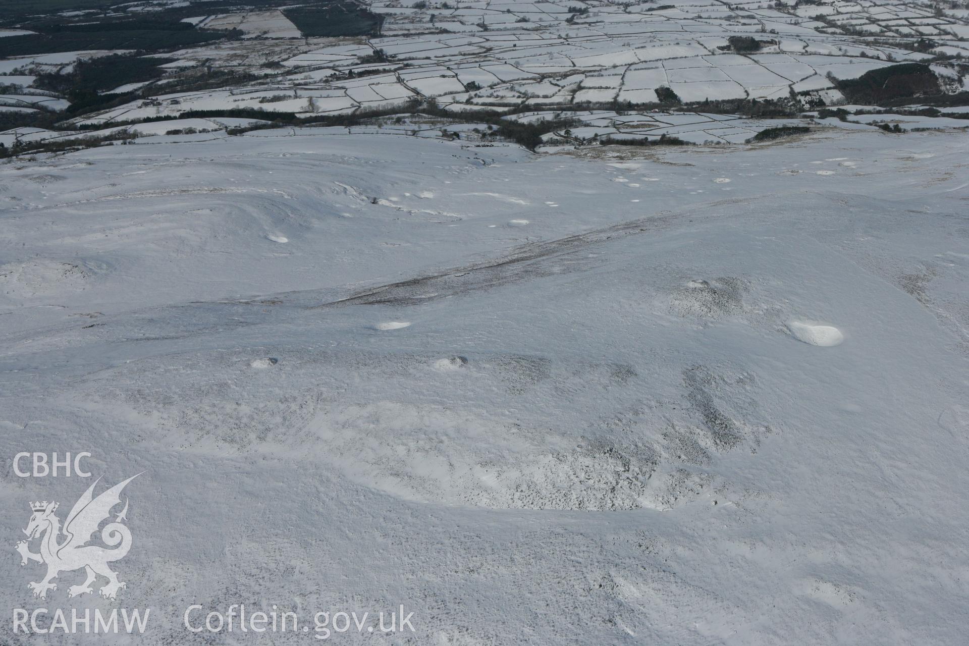 RCAHMW colour oblique photograph of Tair Carn Uchaf cairn, looking north. Taken by Toby Driver on 06/02/2009.