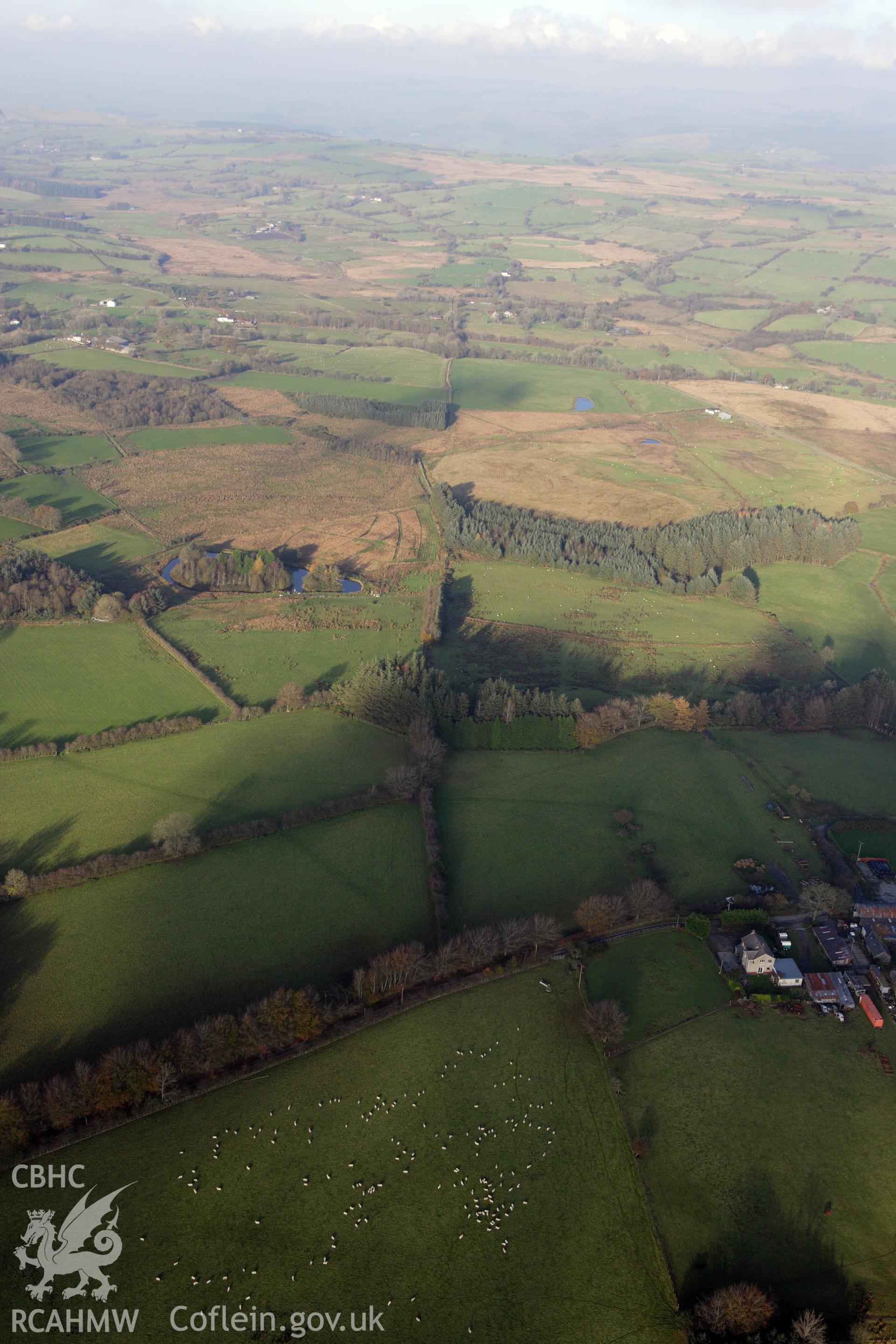 RCAHMW colour oblique aerial photograph of Sarn Helen Roman Road passing Taihirion-Rhos. Taken on 09 November 2009 by Toby Driver