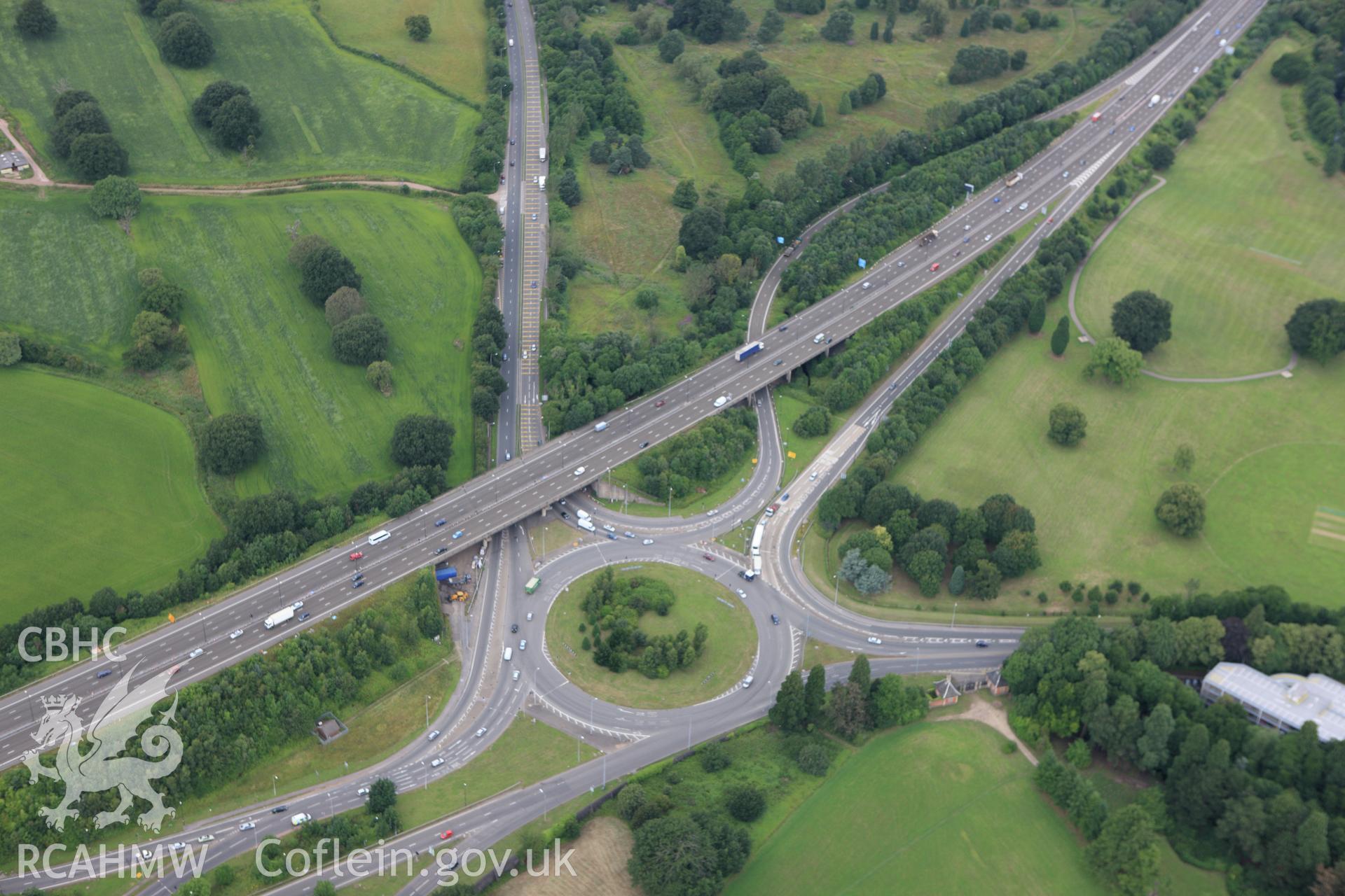 RCAHMW colour oblique aerial photograph of Tredegar House Gatelodges, Newport, and the Tredegar Roundabout. Taken on 09 July 2009 by Toby Driver