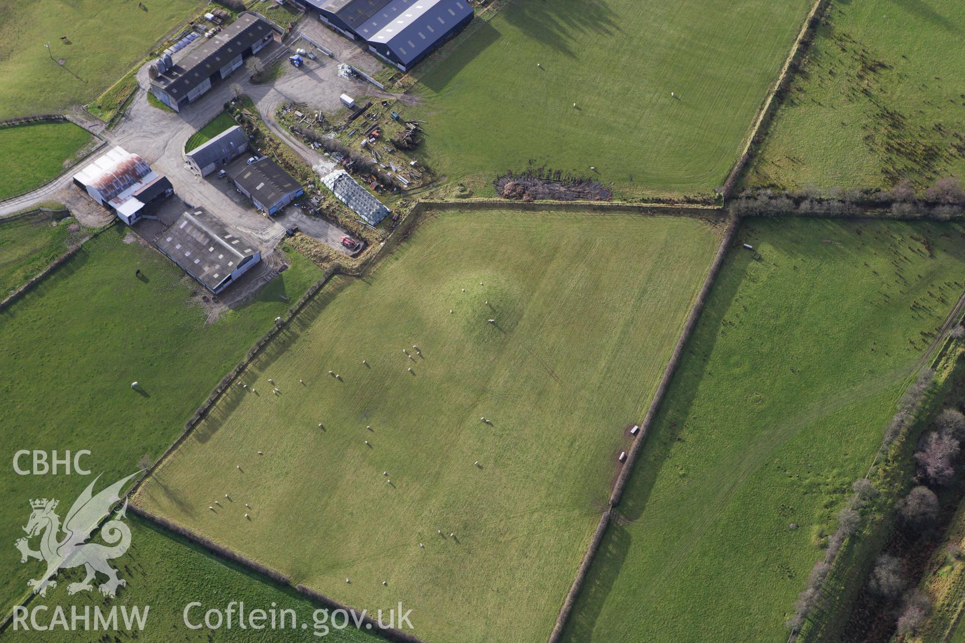 RCAHMW colour oblique photograph of Crugyn round barrow, St Harmon. Taken by Toby Driver on 10/12/2009.