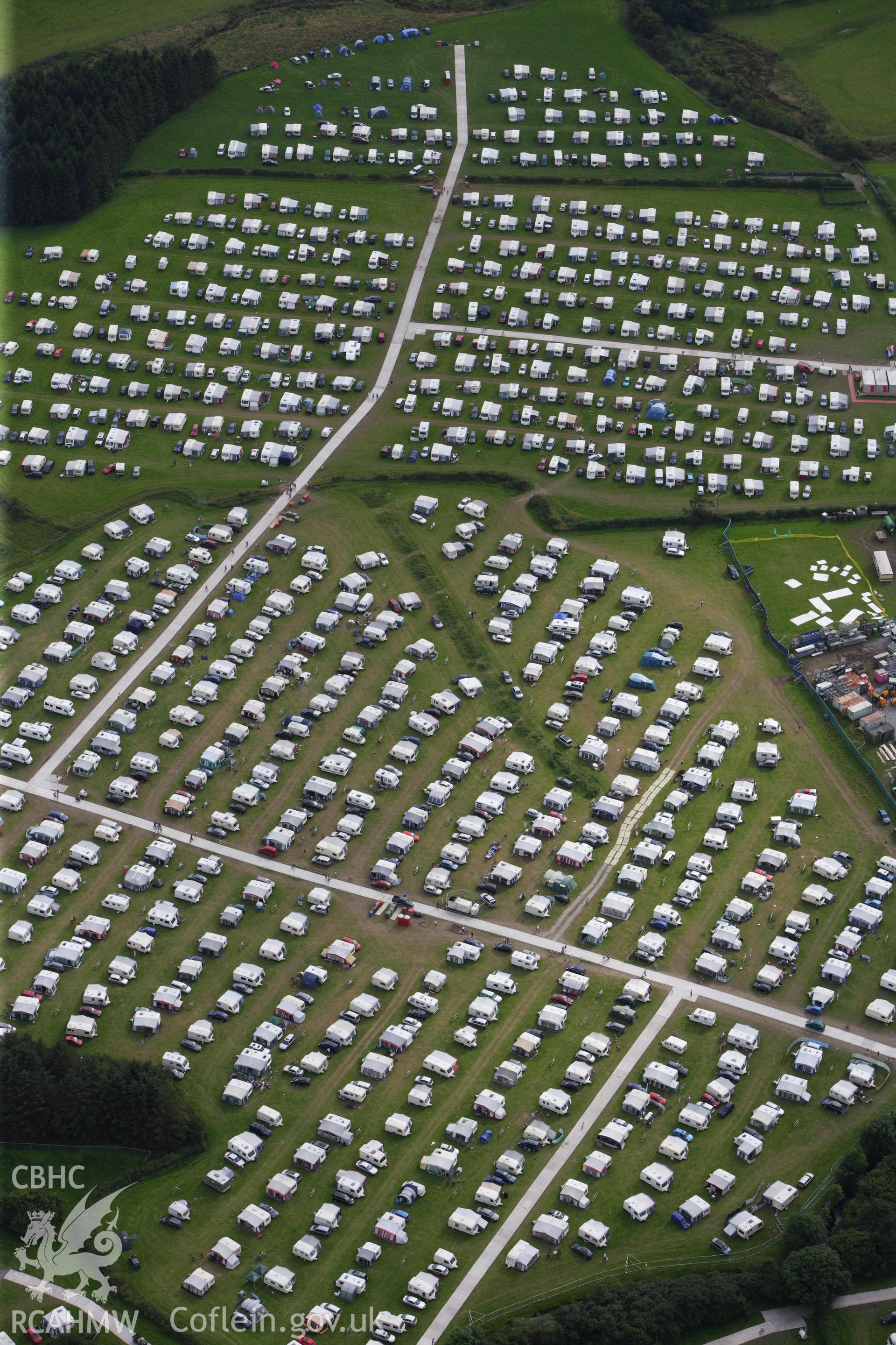 RCAHMW colour oblique aerial photograph of the site of the Eistedddfod at Bala in 1997 and 2009. Taken on 06 August 2009 by Toby Driver