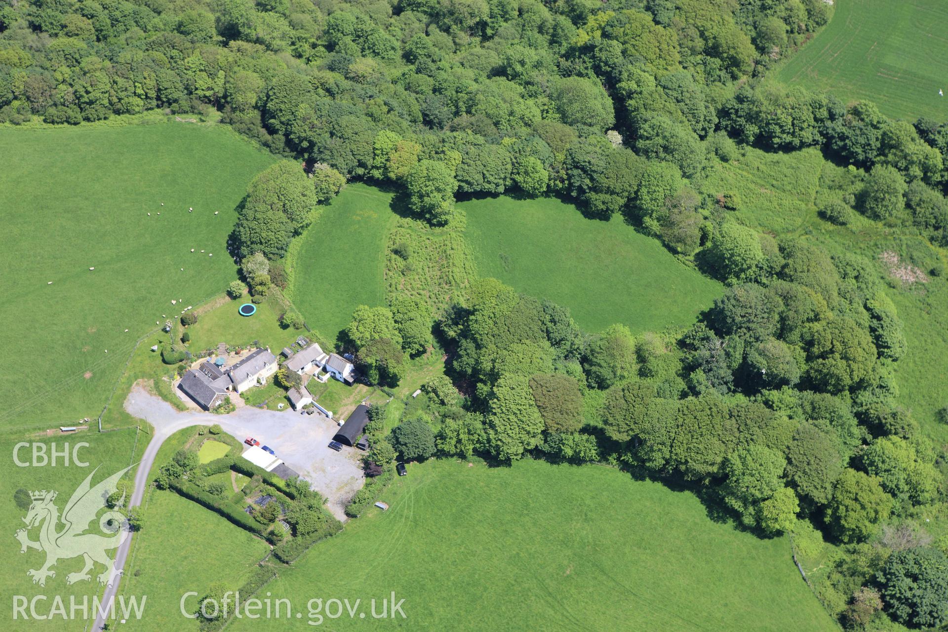 RCAHMW colour oblique aerial photograph of Syke Rath Promontory Fort. Taken on 01 June 2009 by Toby Driver