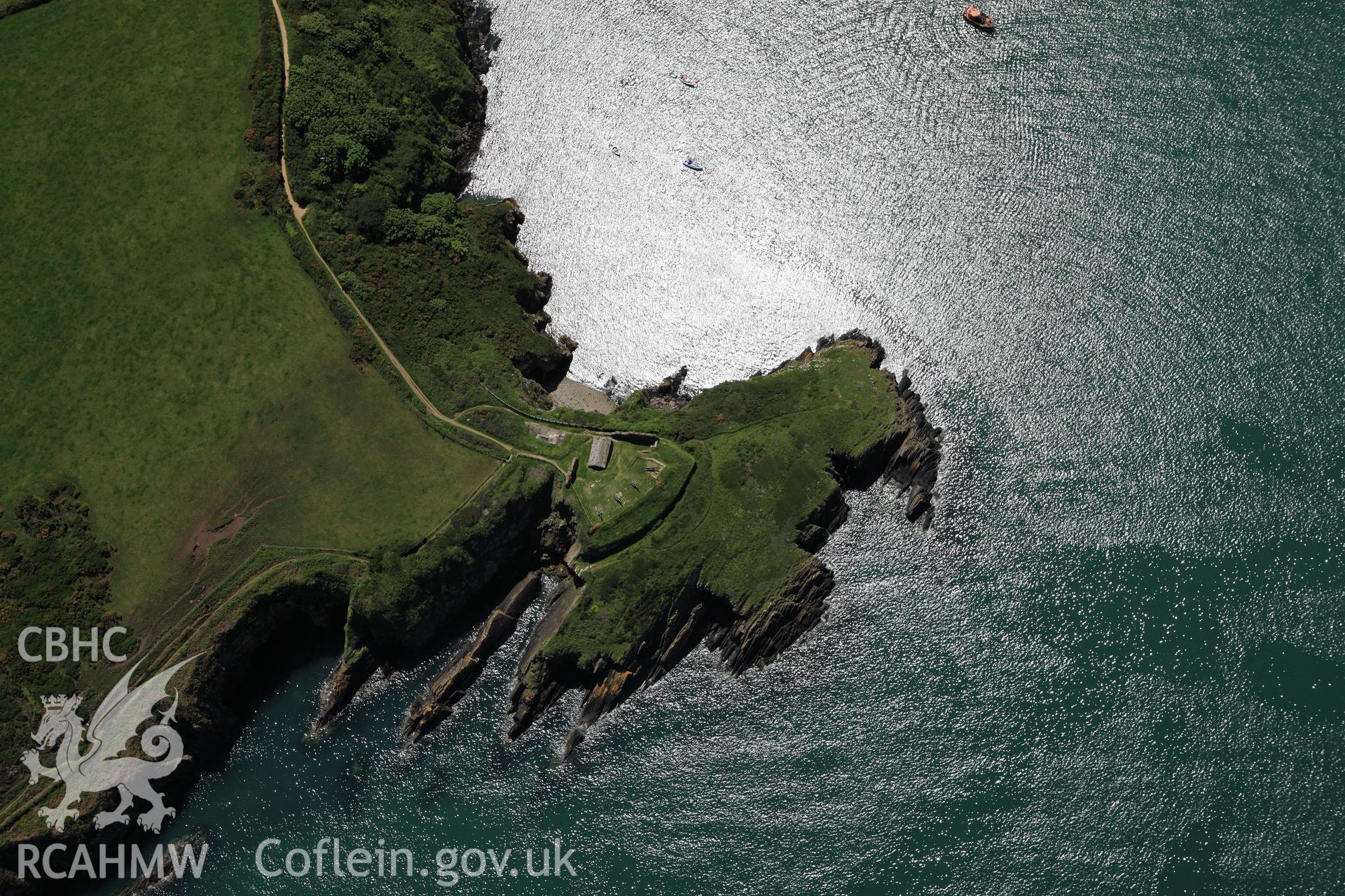 RCAHMW colour oblique aerial photograph of Castle Point Old Fort. Taken on 01 June 2009 by Toby Driver