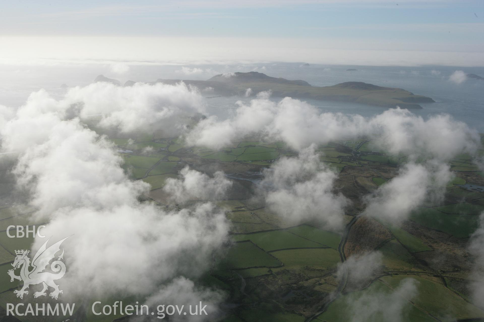 RCAHMW colour oblique aerial photograph of Clegyr Boia and surrounding landscape with cloud. Taken on 28 January 2009 by Toby Driver