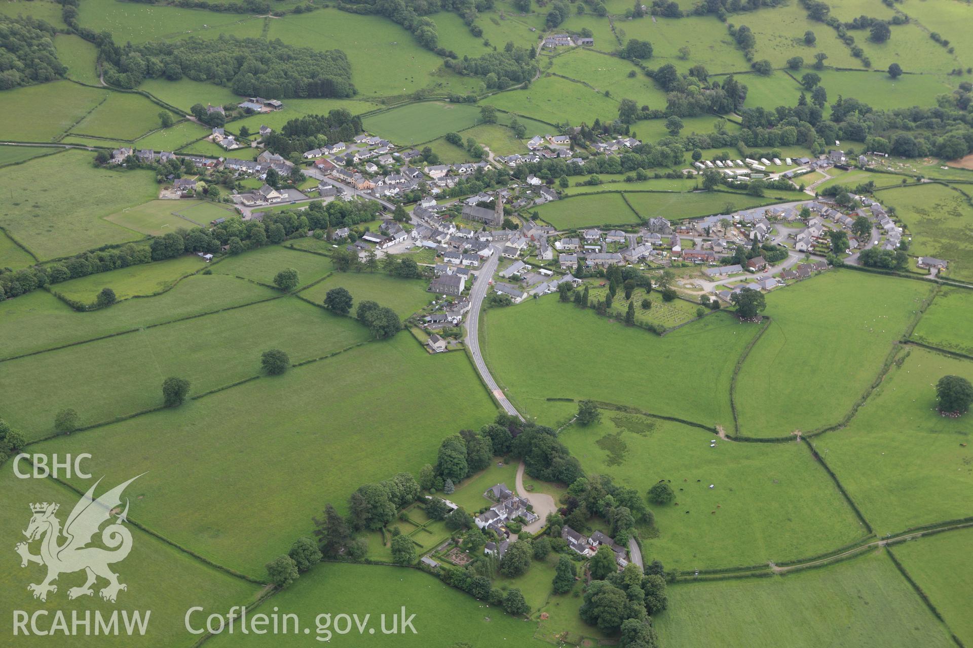 RCAHMW colour oblique photograph of View of the village of Llandrillo. Taken by Toby Driver on 19/06/2009.