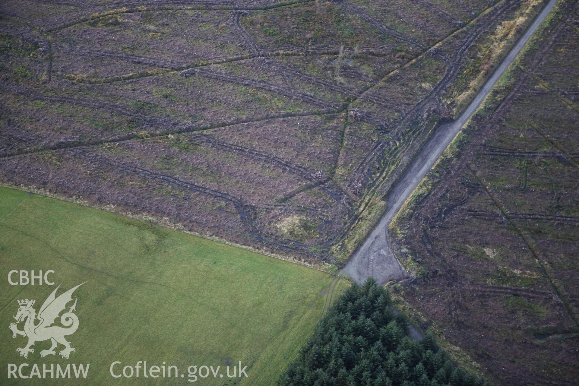 RCAHMW colour oblique aerial photograph of Block Wood Barrow. Taken on 10 December 2009 by Toby Driver