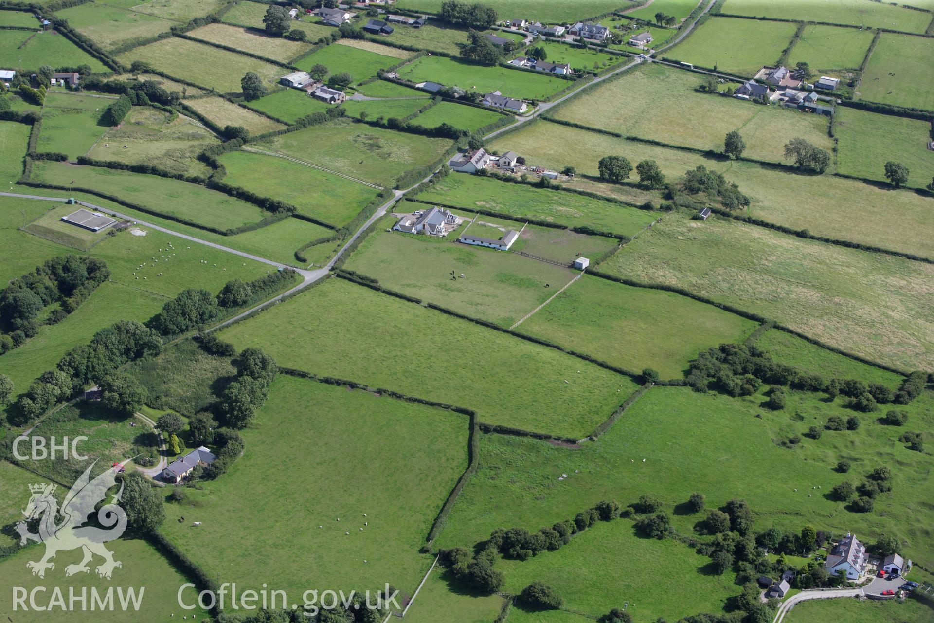 RCAHMW colour oblique aerial photograph of Axton, Tumulus IV. Taken on 30 July 2009 by Toby Driver