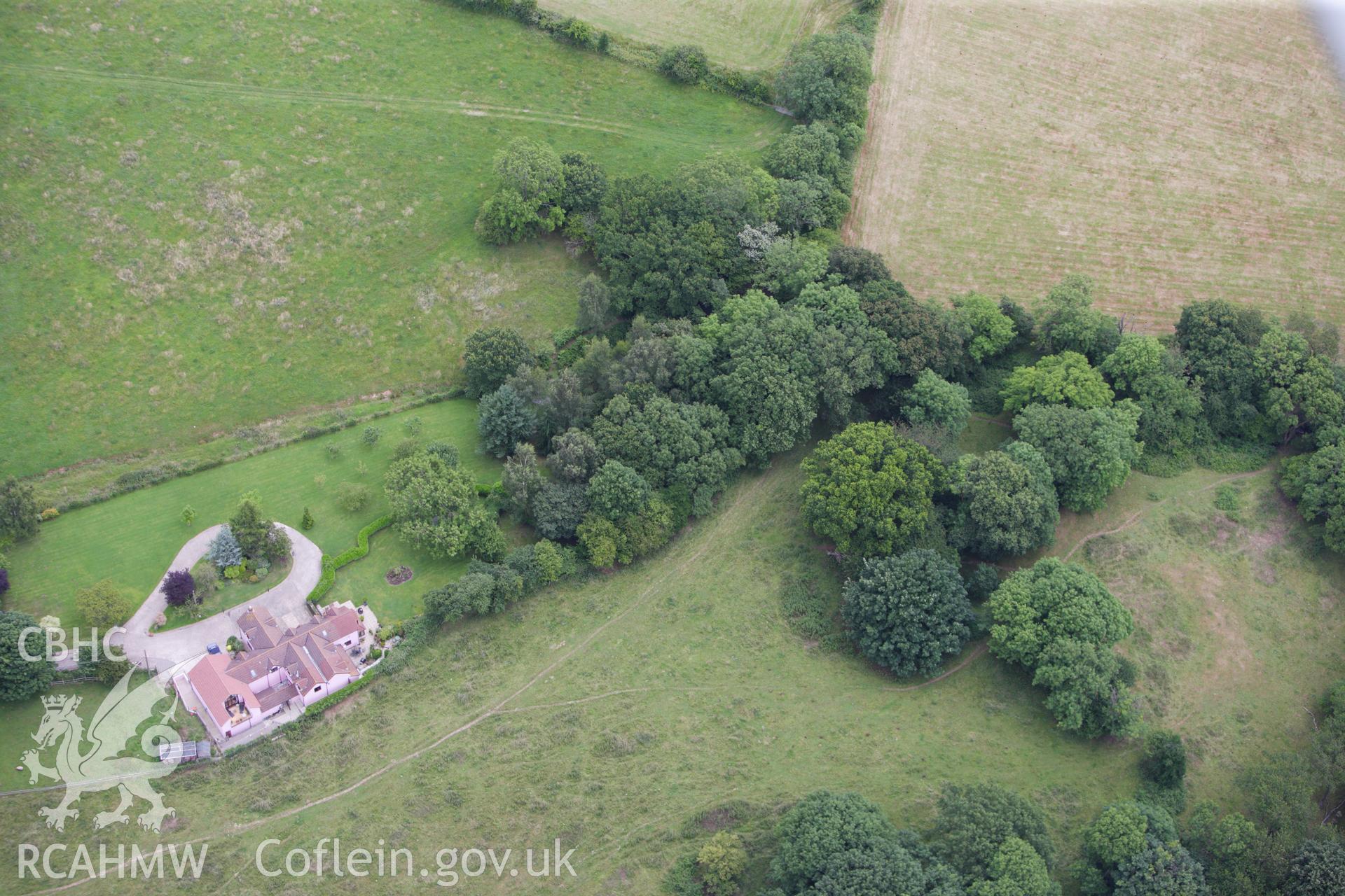 RCAHMW colour oblique aerial photograph of Pencoed Moat. Taken on 09 July 2009 by Toby Driver