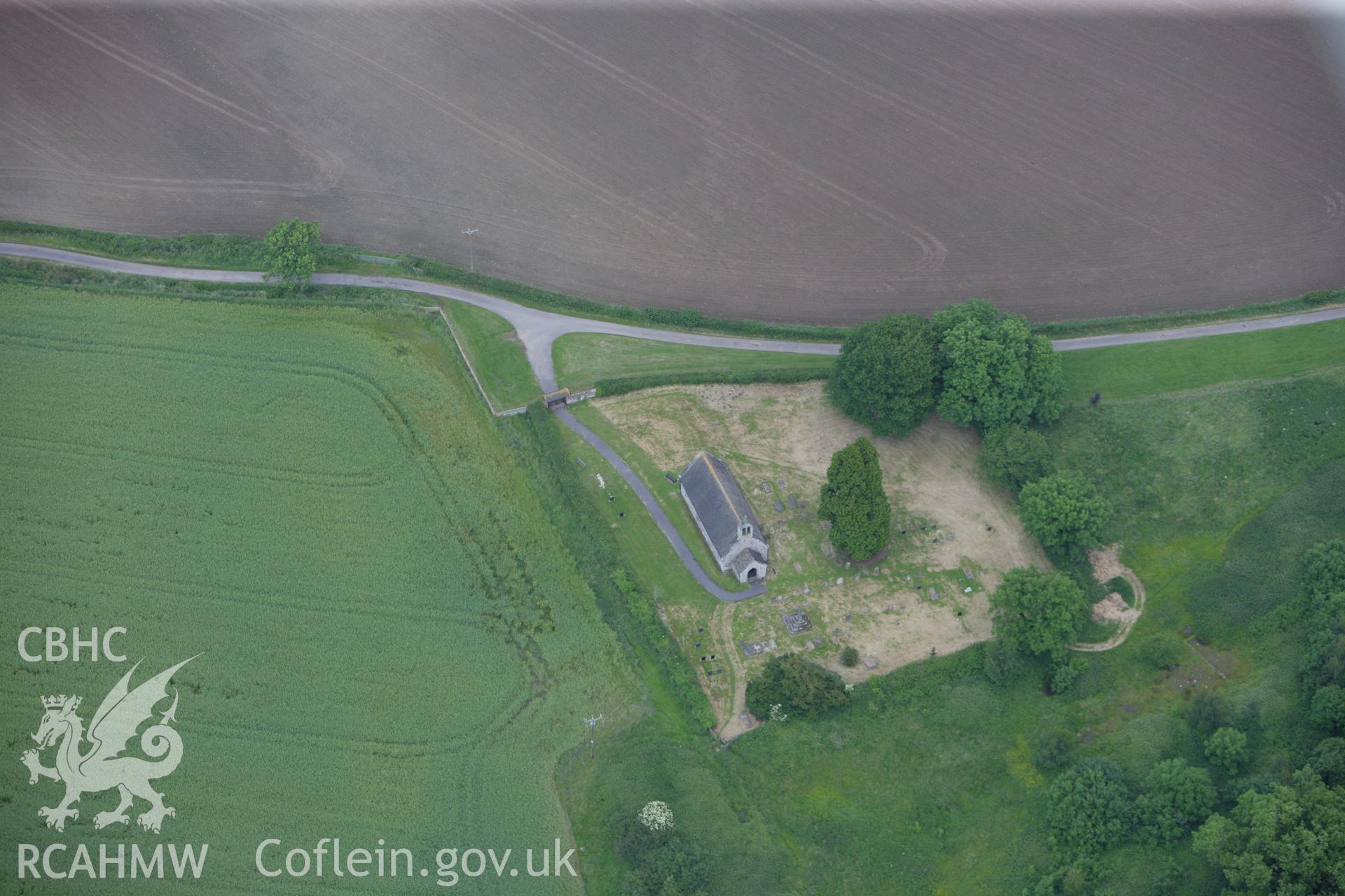 RCAHMW colour oblique aerial photograph of St David's Churchyard Cross, Trostre. Taken on 11 June 2009 by Toby Driver