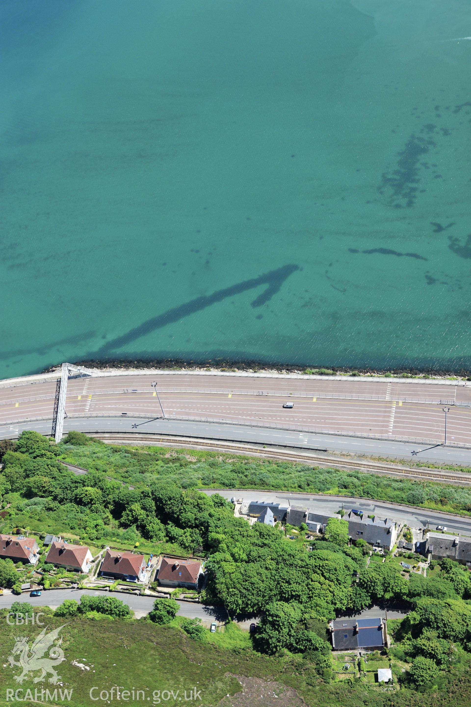 RCAHMW colour oblique aerial photograph of Fishguard Harbour North-West Fish Trap. Taken on 01 June 2009 by Toby Driver