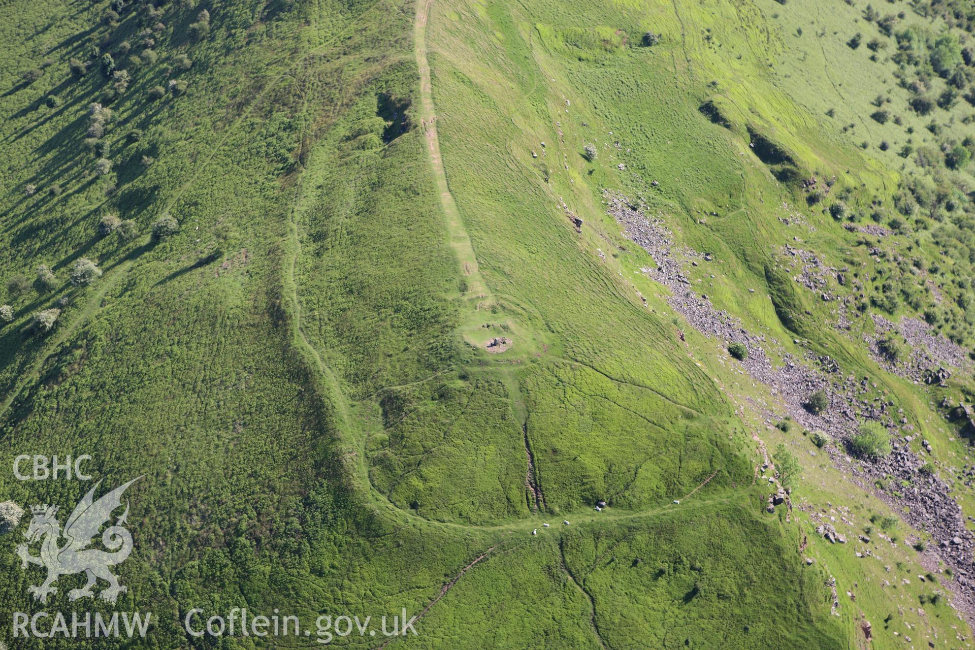 RCAHMW colour oblique aerial photograph of Skirrid Fawr Summit Enclosure. Taken on 11 June 2009 by Toby Driver