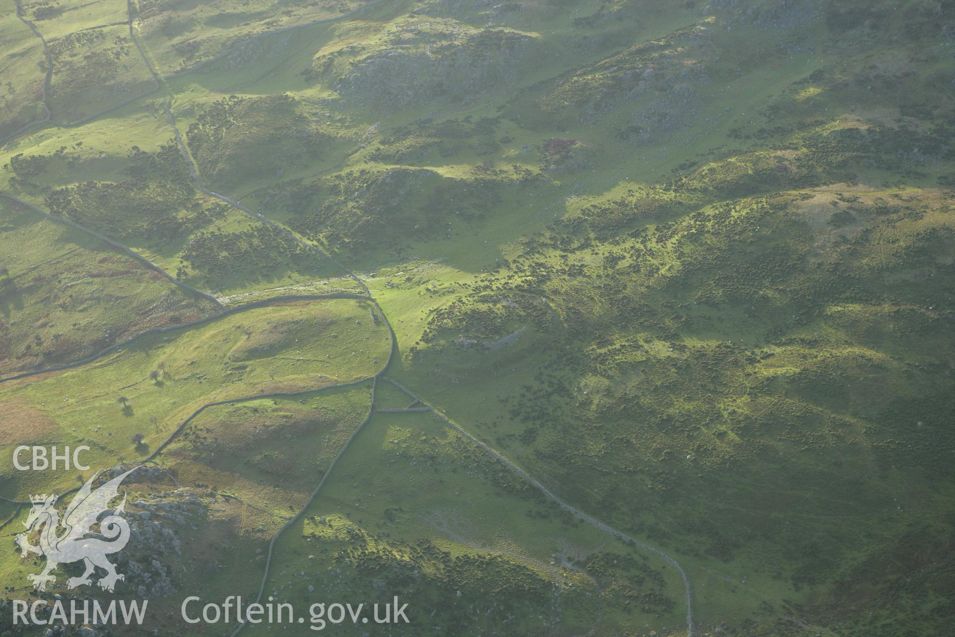 RCAHMW colour oblique aerial photograph of Caer Bach Hillfort. Taken on 10 December 2009 by Toby Driver