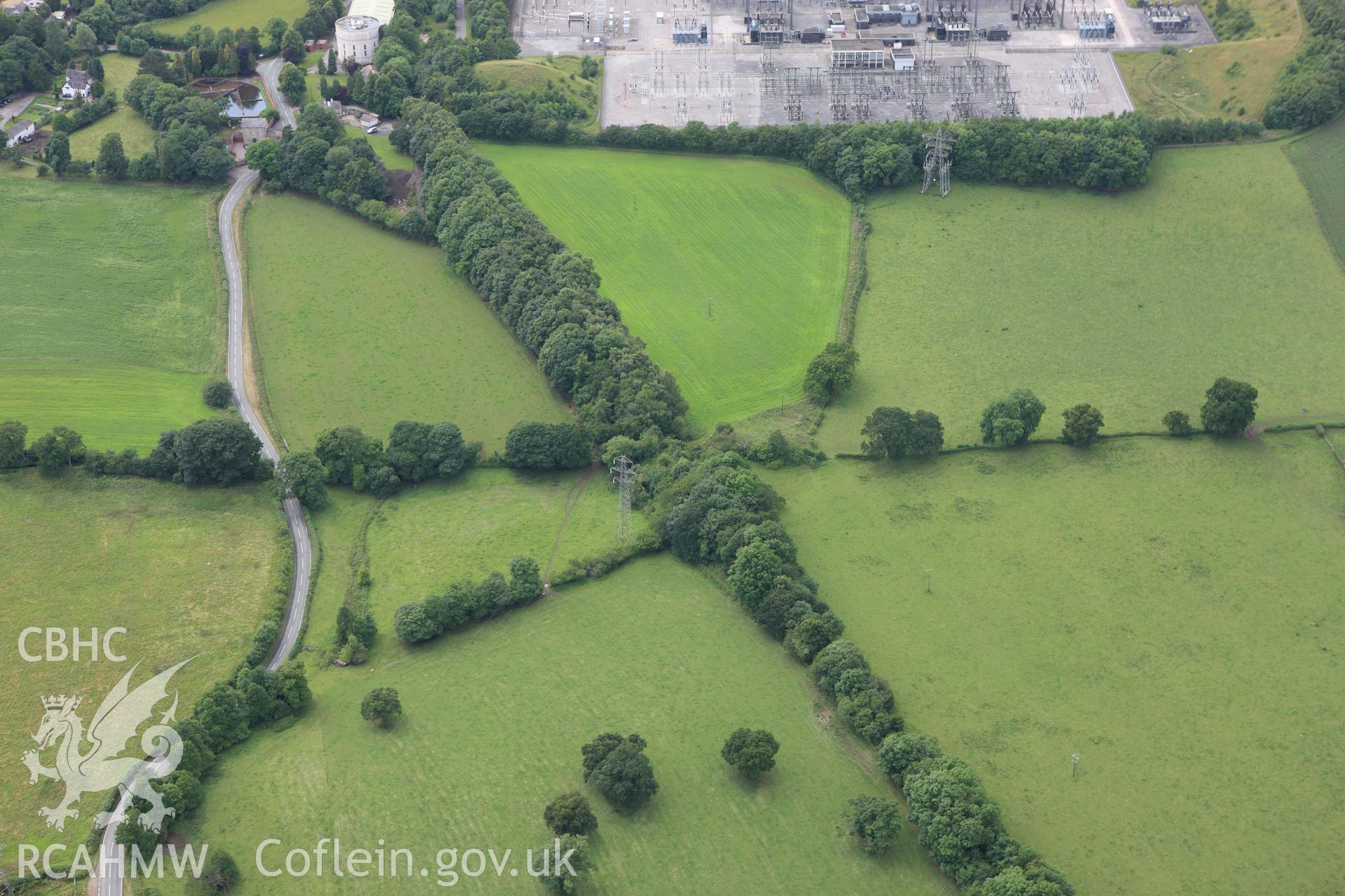 RCAHMW colour oblique aerial photograph of a section of Offa's Dyke extending 120m From the railway to Bronwylfa Road, Legacy. Taken on 08 July 2009 by Toby Driver