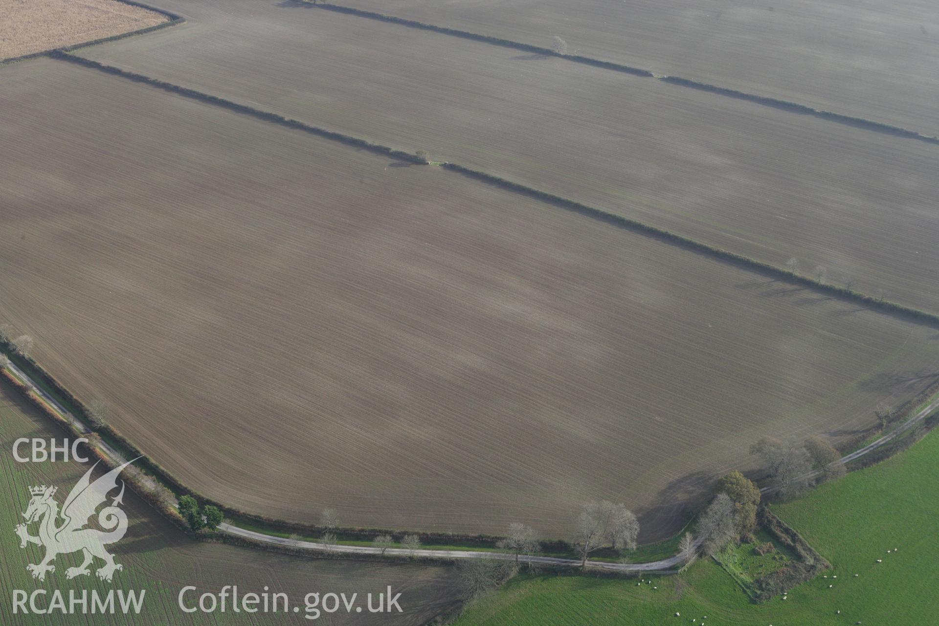 RCAHMW colour oblique aerial photograph of Cawrence Cropmark Enclosure. Taken on 09 November 2009 by Toby Driver