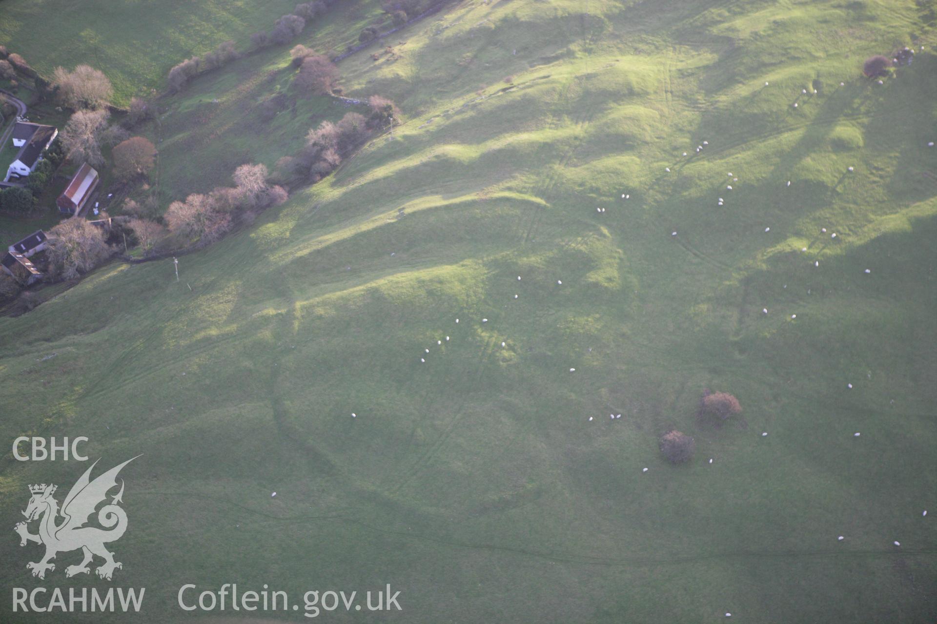 RCAHMW colour oblique aerial photograph of showing defended enclosure at Marian Ffrith. Taken on 10 December 2009 by Toby Driver