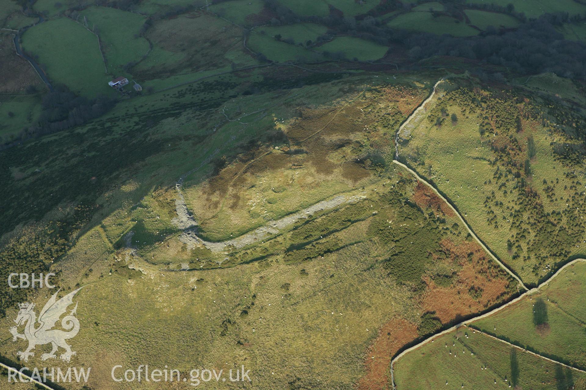 RCAHMW colour oblique aerial photograph of Pen-y-Gaer Hillfort. Taken on 10 December 2009 by Toby Driver