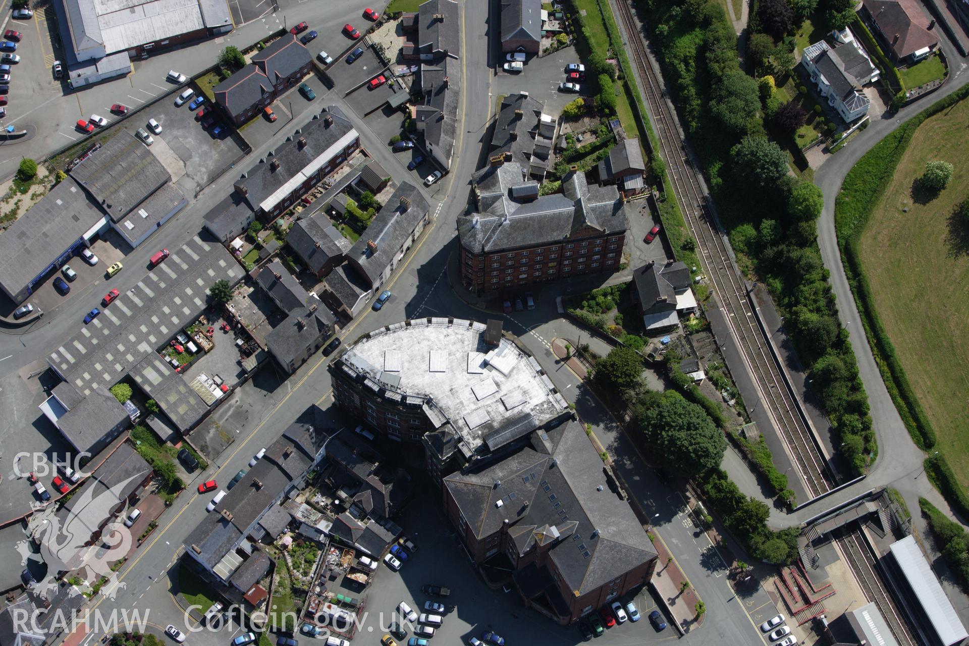 RCAHMW colour oblique aerial photograph of Royal Welsh Warehouse, Old Kerry Road, Newtown. Taken on 02 June 2009 by Toby Driver