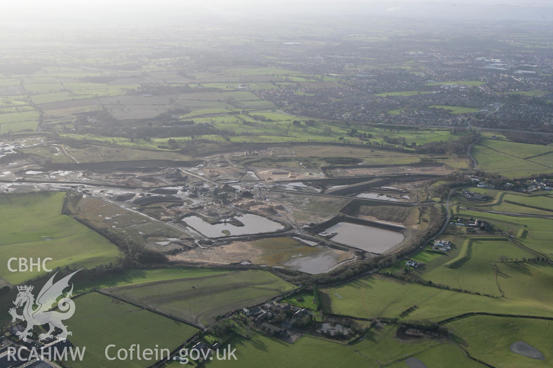 RCAHMW colour oblique photograph of Borras sand and gravel quarry, site of former airfield, Wrexham. Taken by Toby Driver on 21/01/2009.