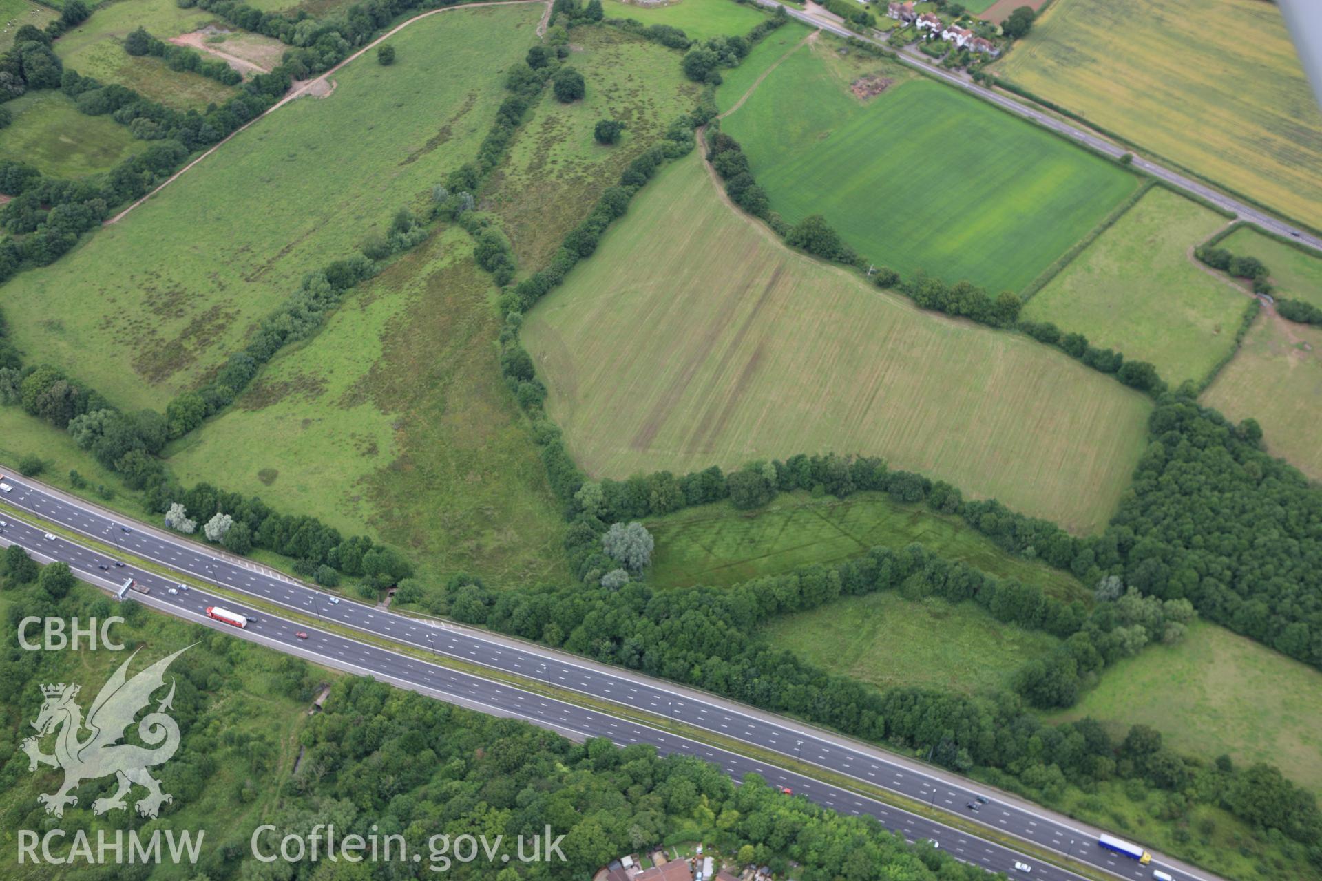 RCAHMW colour oblique aerial photograph of Ford Farm Roman Villa, Langstone. Taken on 09 July 2009 by Toby Driver