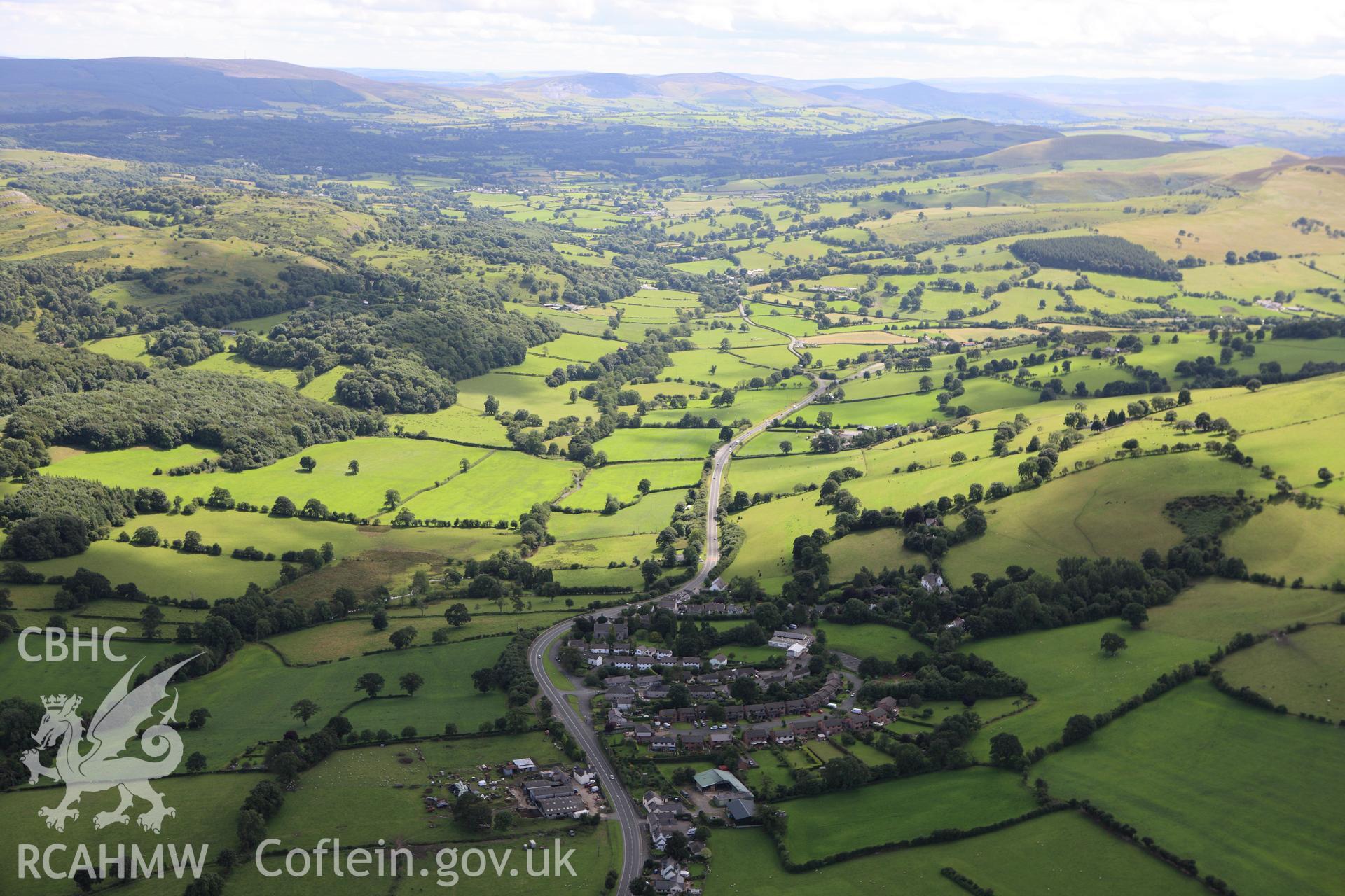 RCAHMW colour oblique aerial photograph of Llanferres village. Taken on 30 July 2009 by Toby Driver