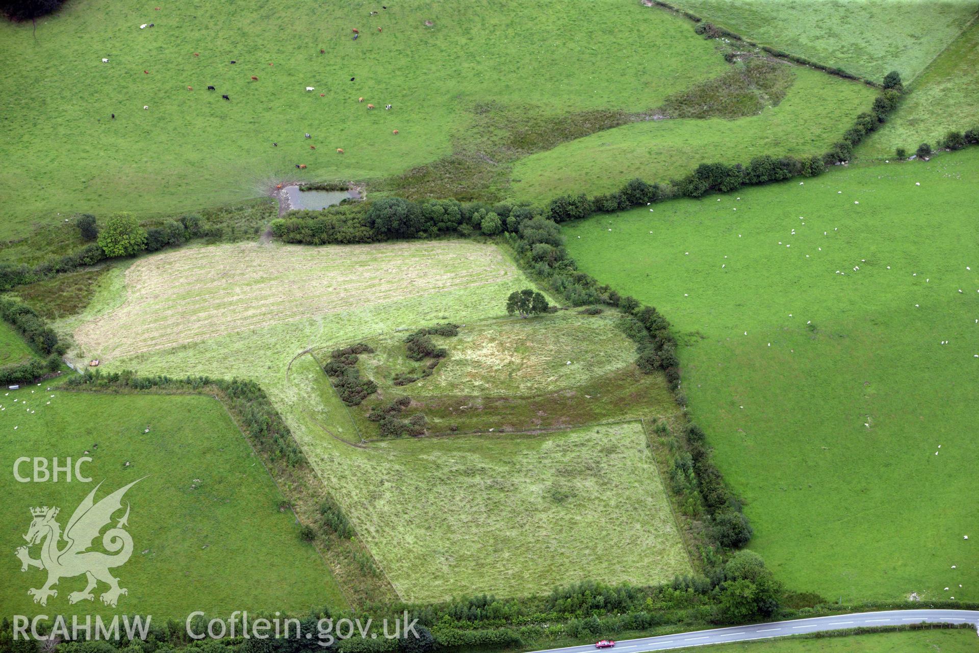 RCAHMW colour oblique aerial photograph of Moel Fodig Enclosure. Taken on 08 July 2009 by Toby Driver