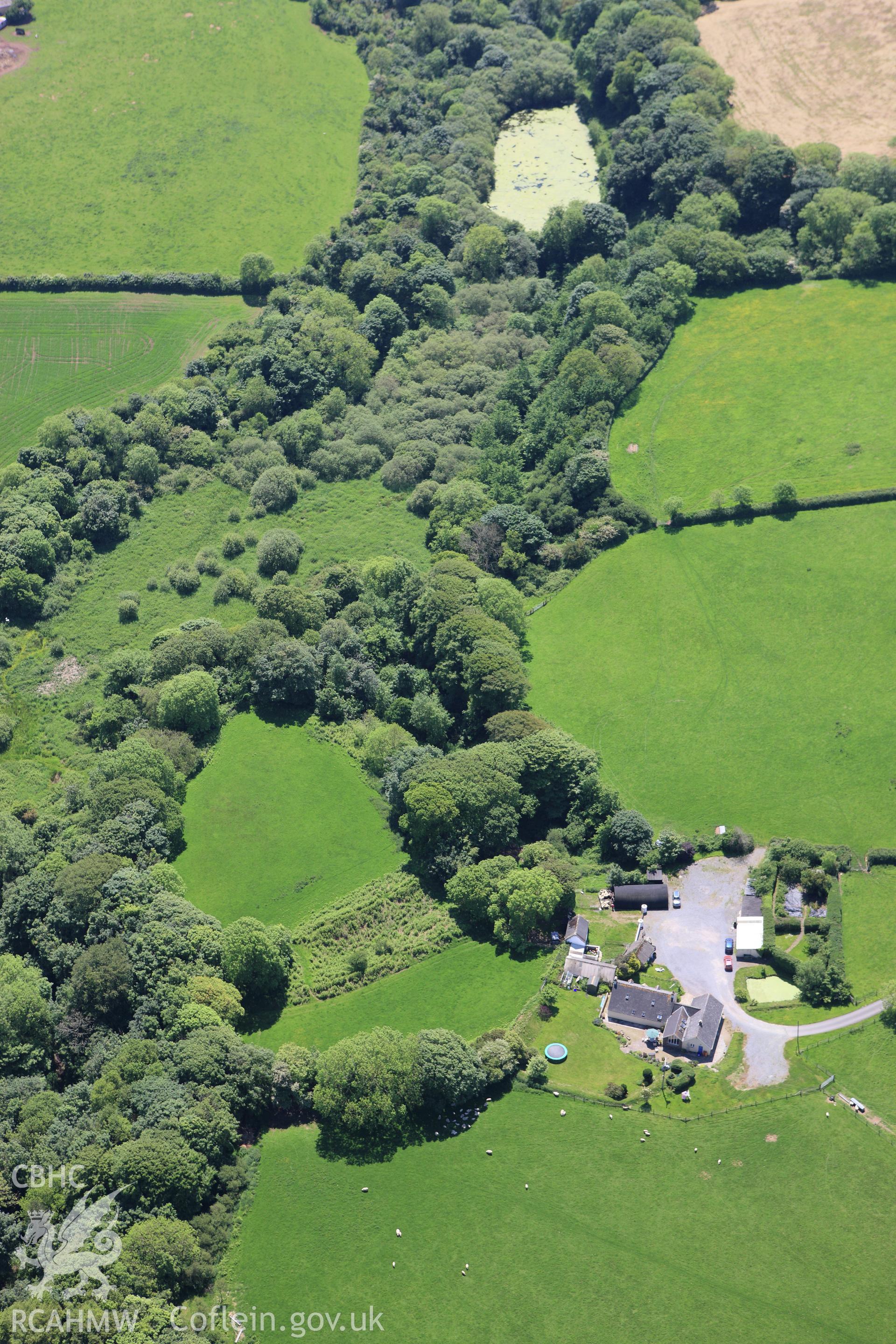 RCAHMW colour oblique aerial photograph of Syke Rath Promontory Fort. Taken on 01 June 2009 by Toby Driver