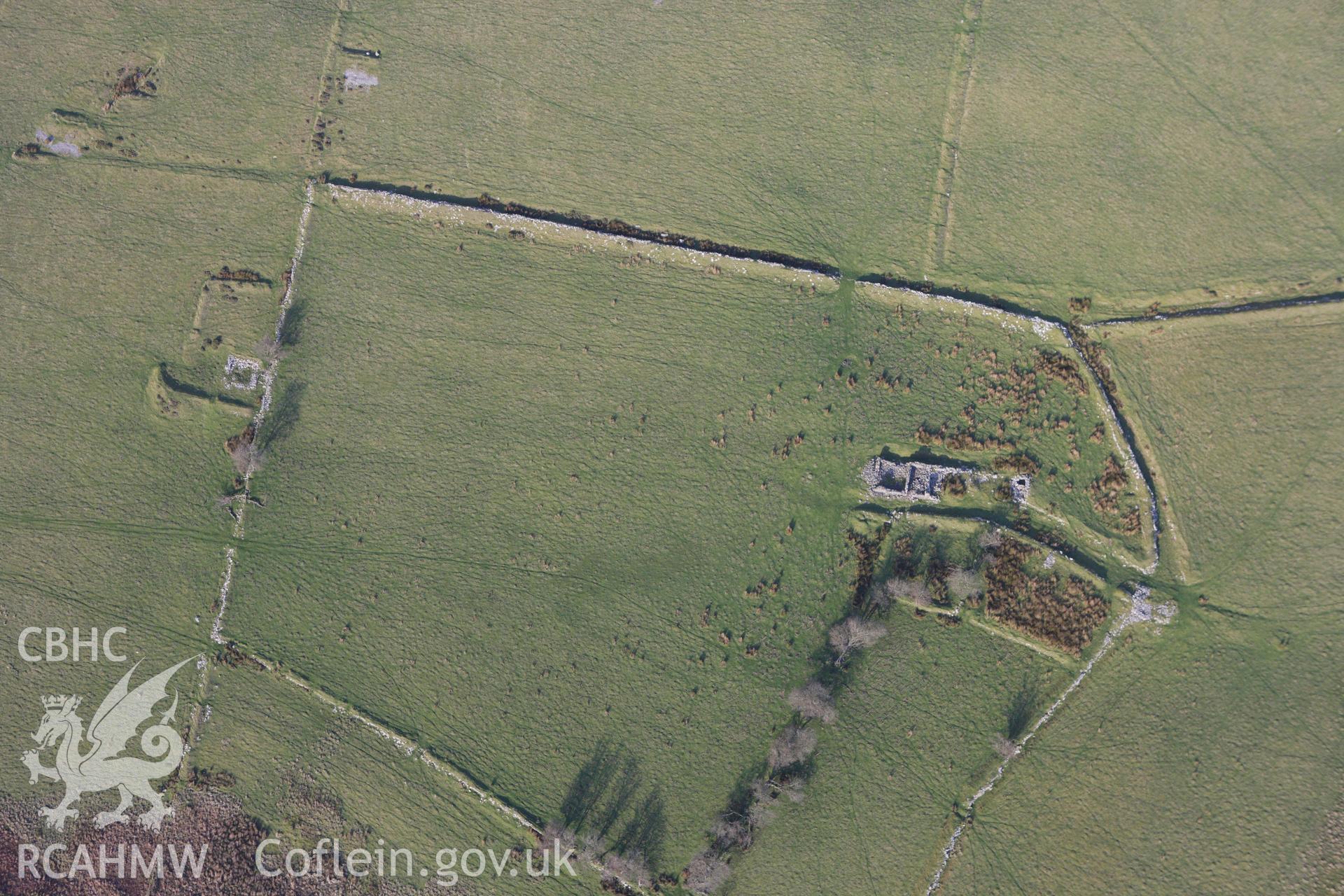 RCAHMW colour oblique aerial photograph of an earthwork complex at Esgair Mwyn Lead Mine. Taken on 09 November 2009 by Toby Driver