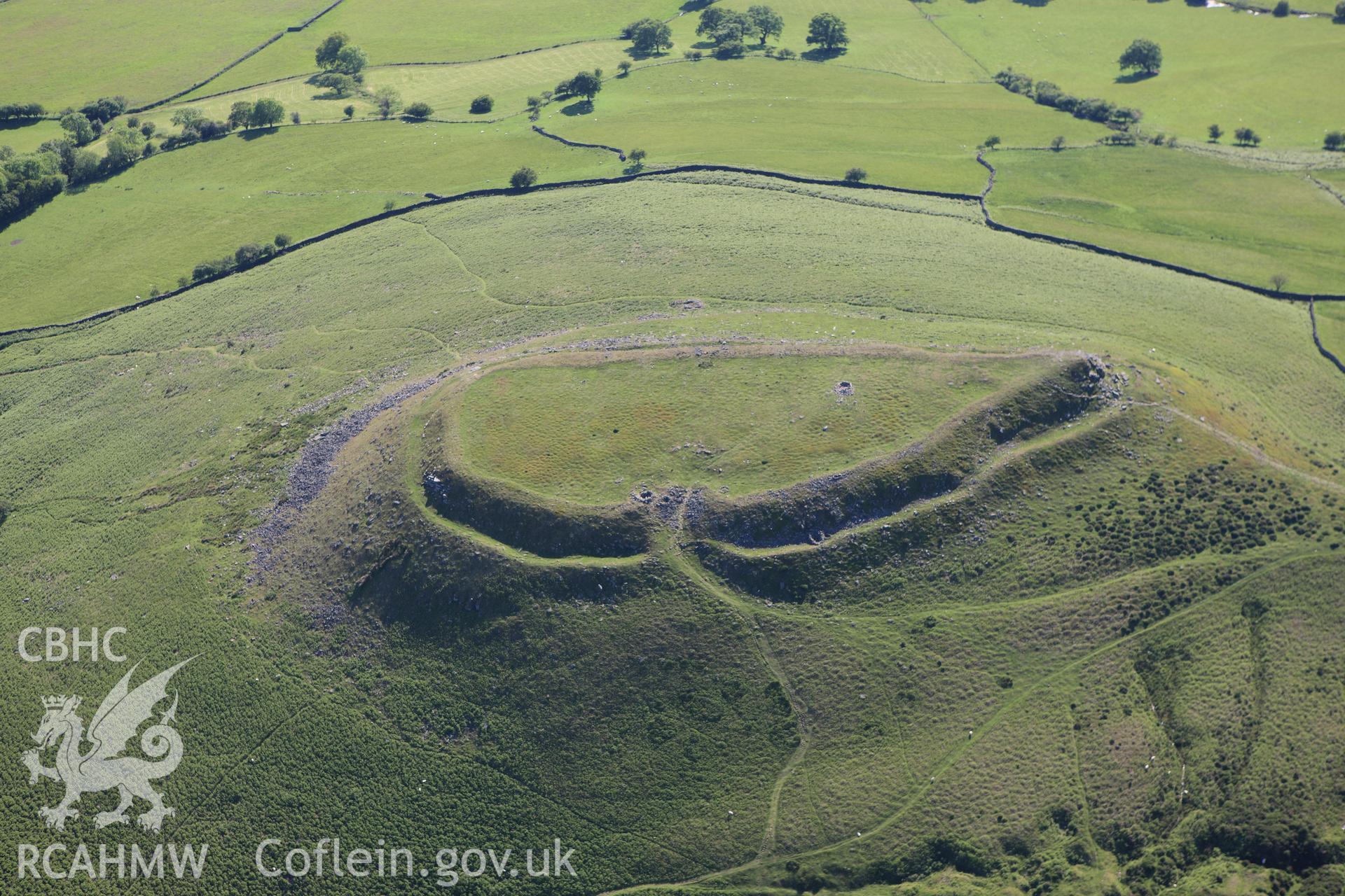 RCAHMW colour oblique aerial photograph of Crug Hywel Camp. Taken on 11 June 2009 by Toby Driver