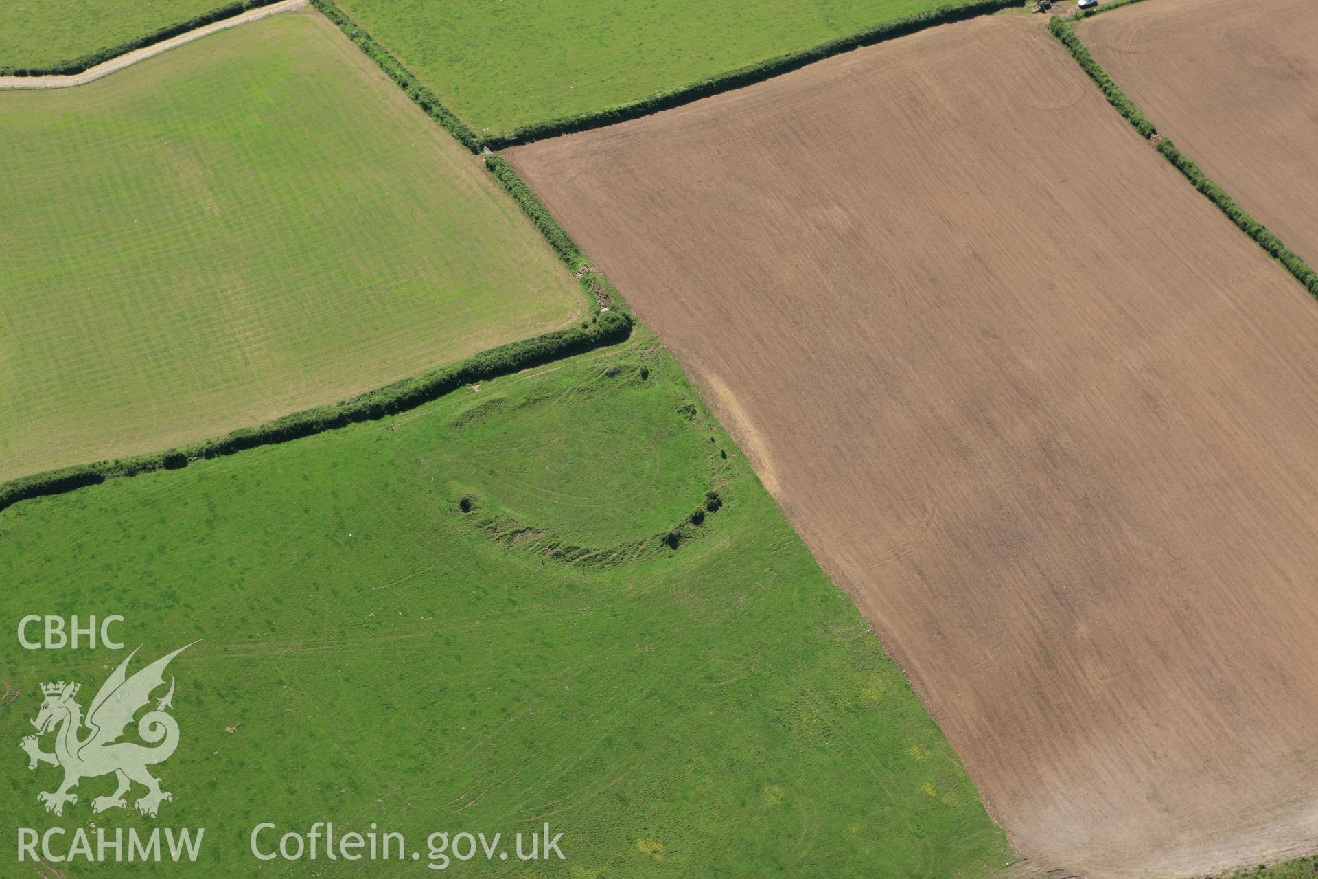 RCAHMW colour oblique aerial photograph of Ford Camp showing ploughing. Taken on 01 June 2009 by Toby Driver