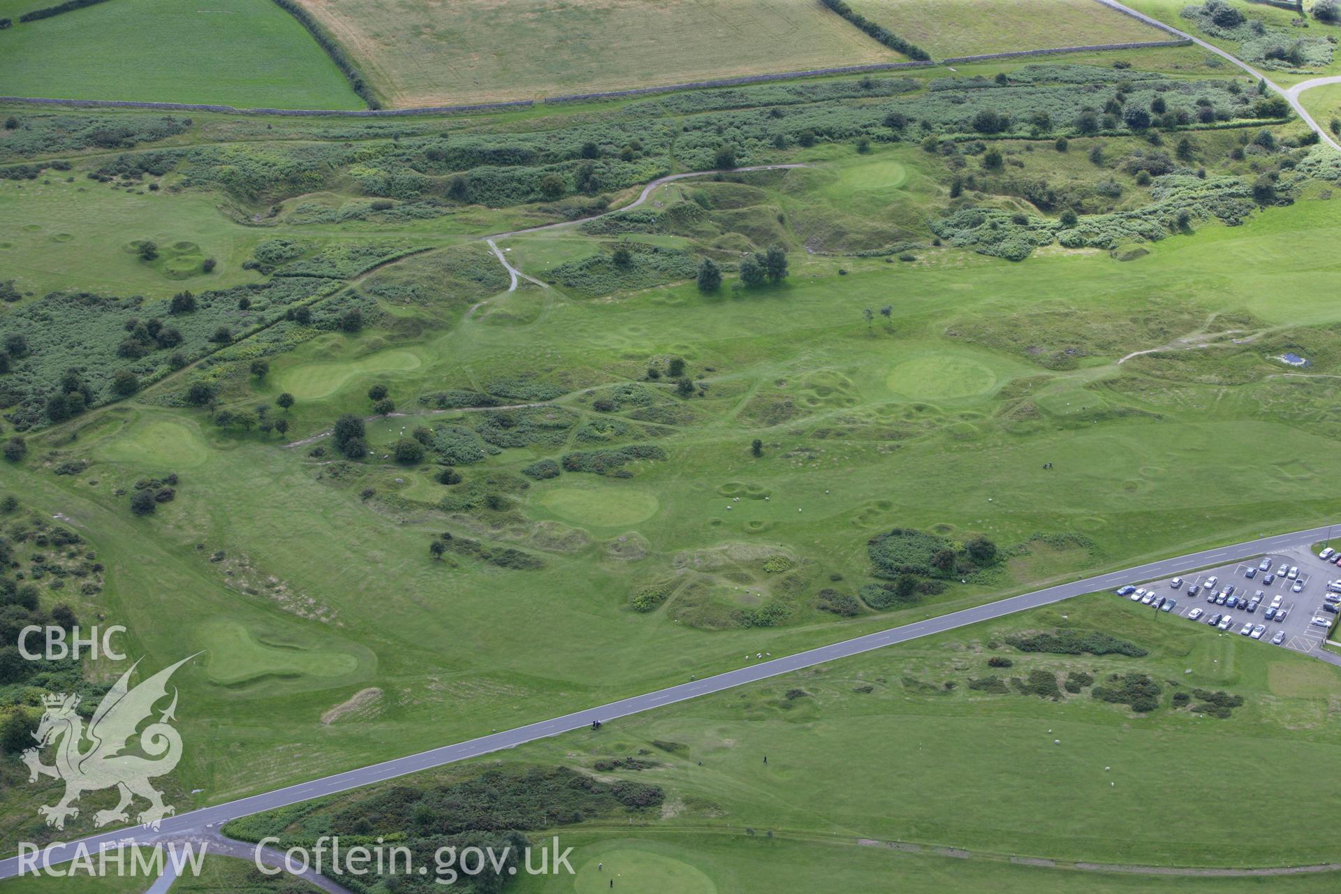 RCAHMW colour oblique aerial photograph of Golf House Round Barrows A and B. Taken on 30 July 2009 by Toby Driver