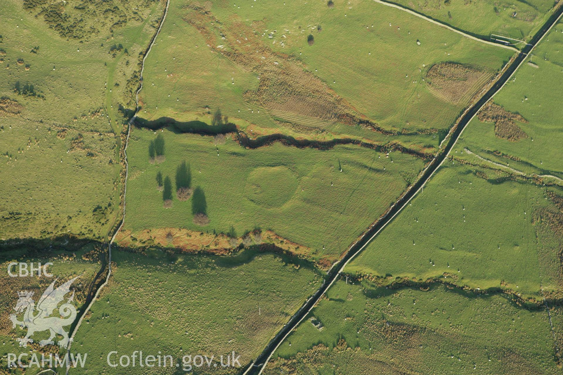 RCAHMW colour oblique aerial photograph of a homestead near Maen-y-Bardd. Taken on 10 December 2009 by Toby Driver