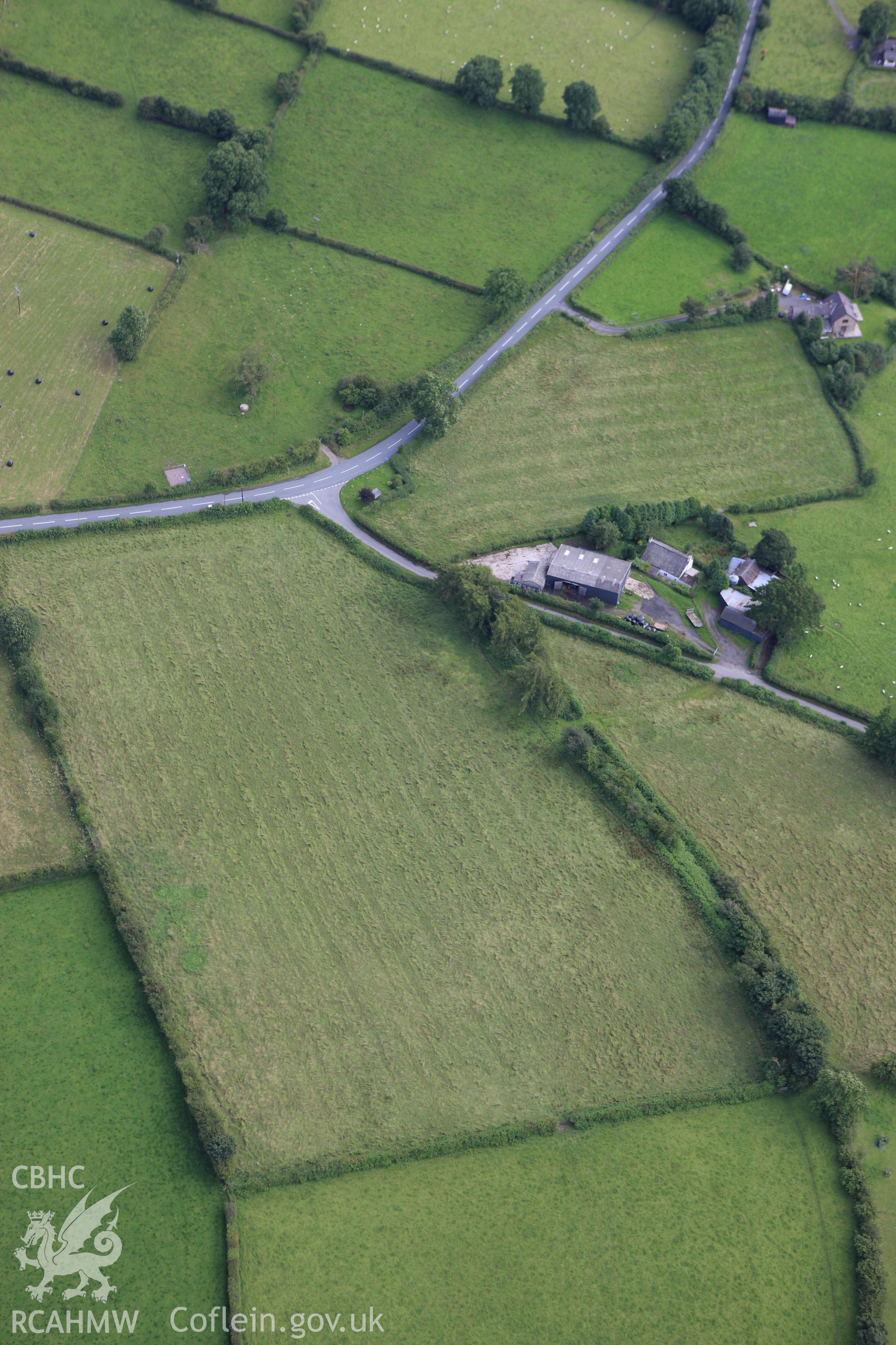 RCAHMW colour oblique aerial photograph of a section of Offa's Dyke  extending 200m south To Pool House, Rhos-y-Meirch. Taken on 23 July 2009 by Toby Driver