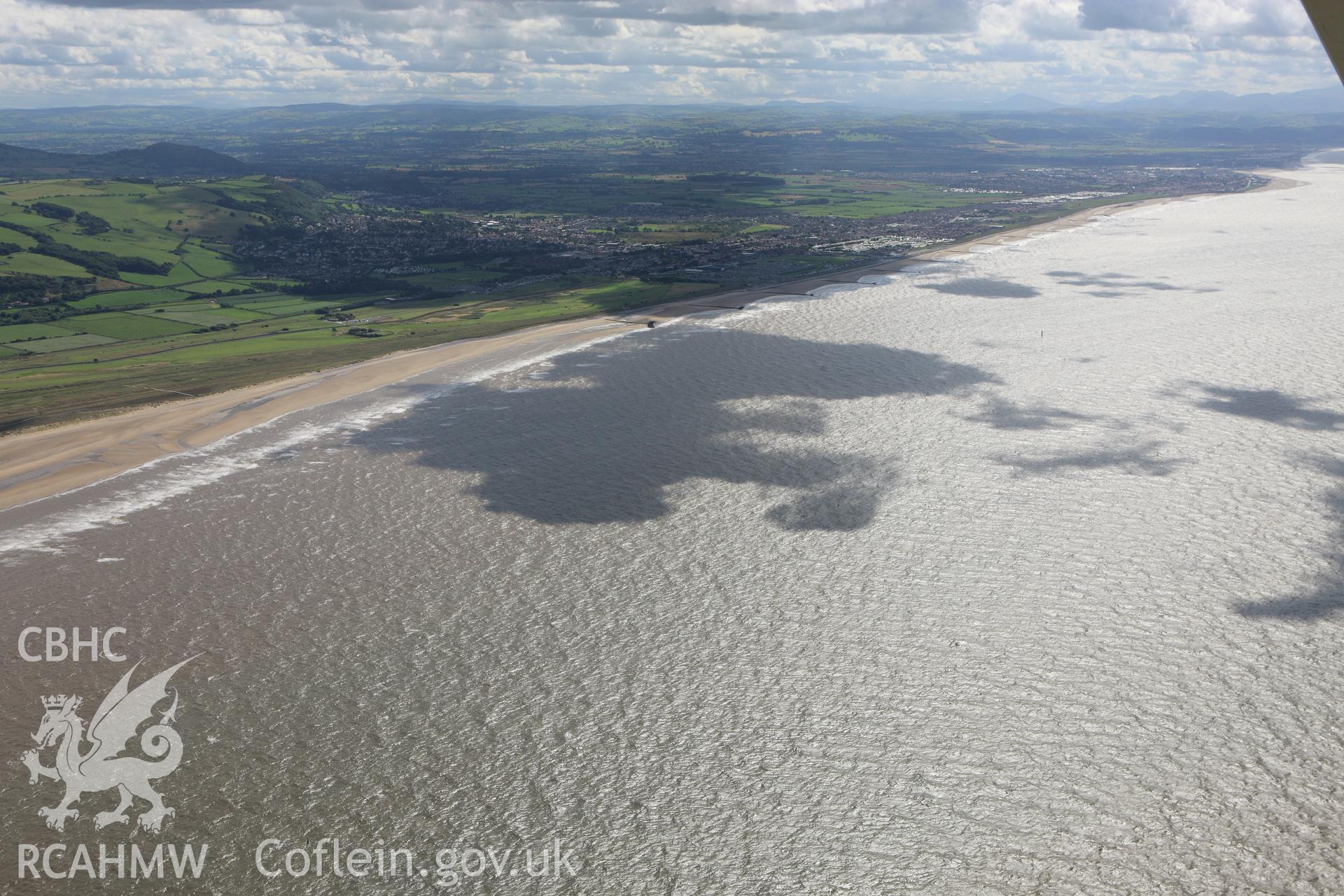 RCAHMW colour oblique aerial photograph of Prestatyn and the coast. Taken on 30 July 2009 by Toby Driver