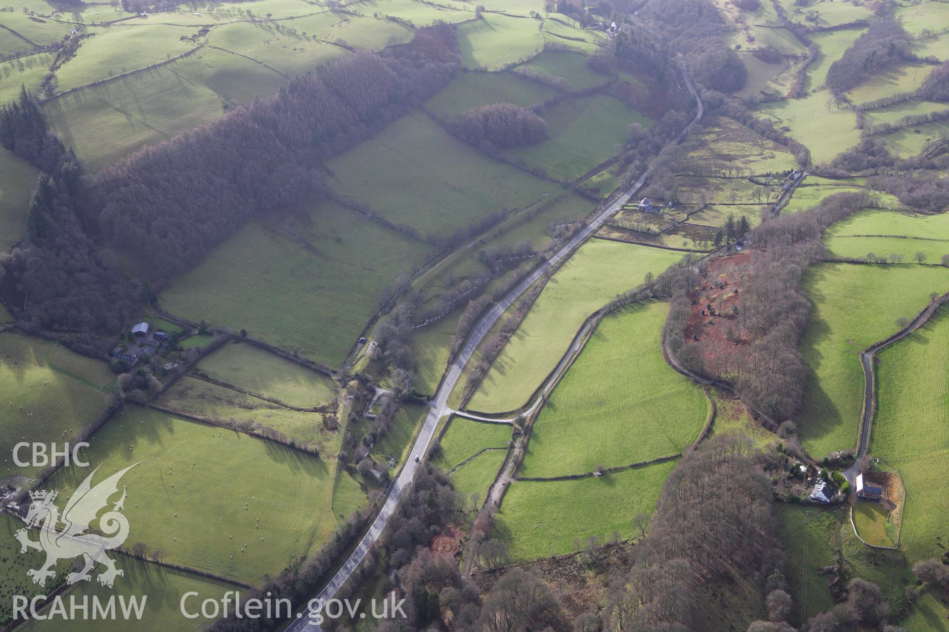 RCAHMW colour oblique aerial photograph of a section of the dismantled Manchester and Milford Railway between Llangurig and Llanidloes looking south-west. Taken on 10 December 2009 by Toby Driver