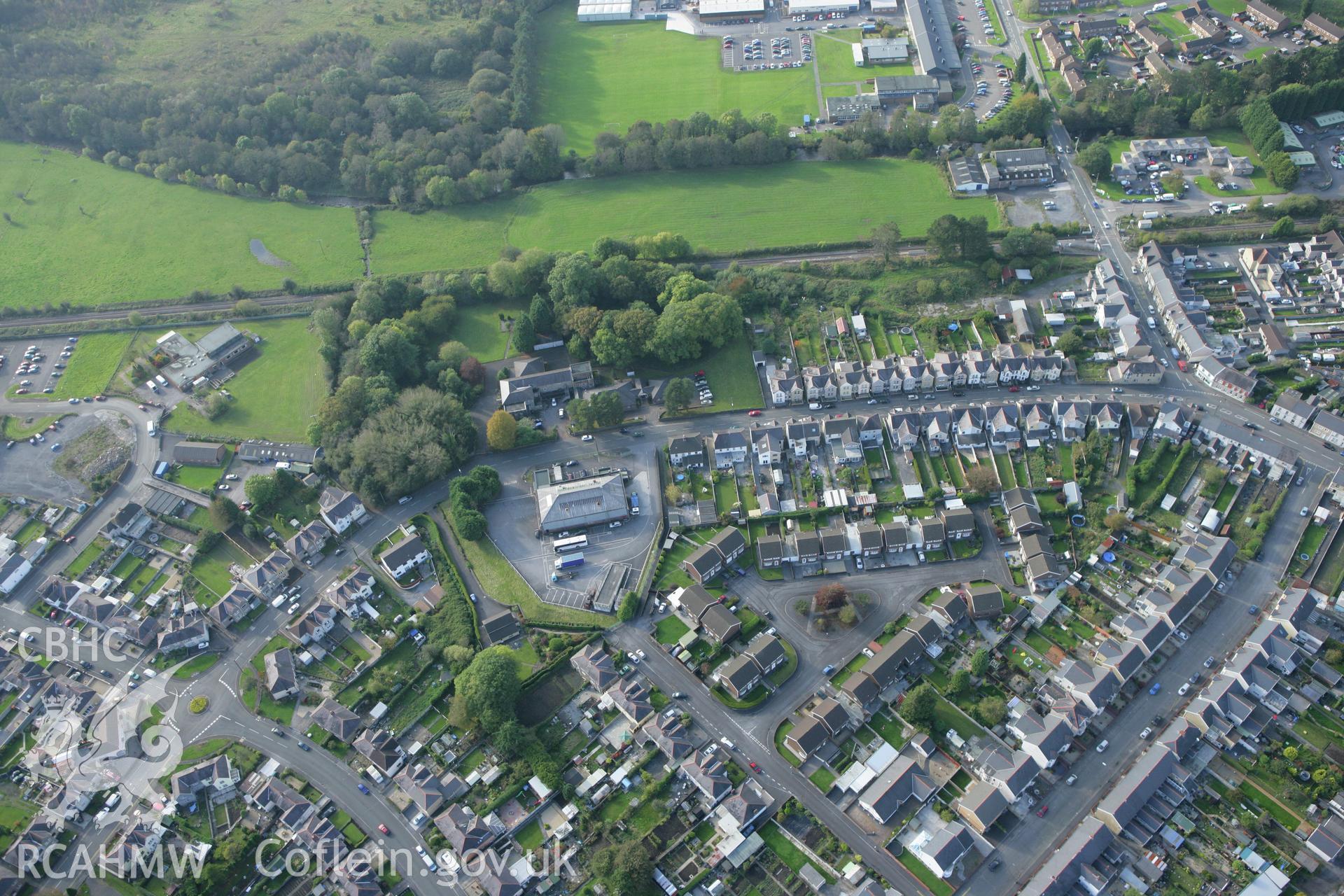 RCAHMW colour oblique aerial photograph of Tir-y-Dail Motte and Bailey, Ammanford, Rhydaman. Taken on 14 October 2009 by Toby Driver