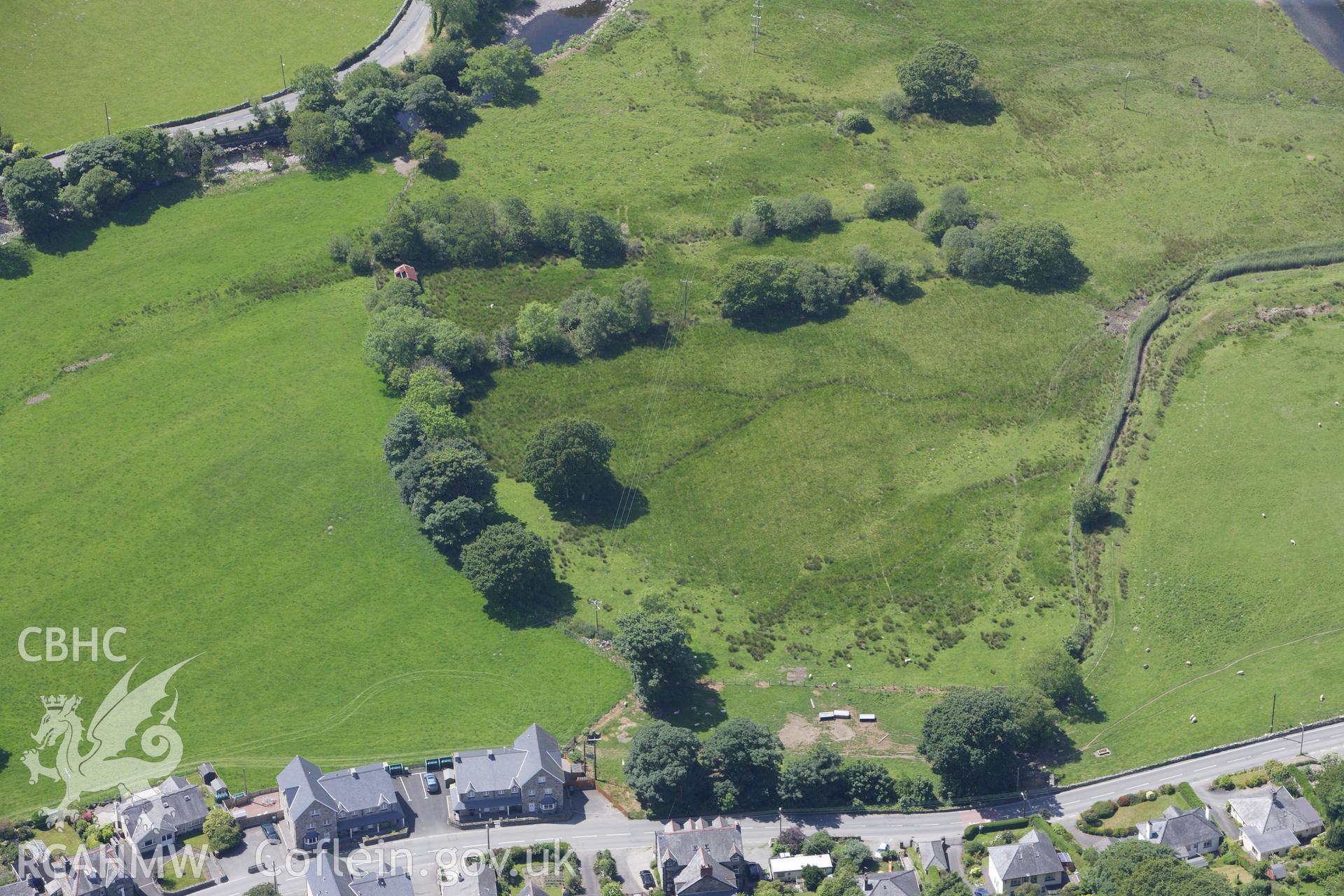 RCAHMW colour oblique aerial photograph of Llanbedr Standing Stones. Taken on 16 June 2009 by Toby Driver