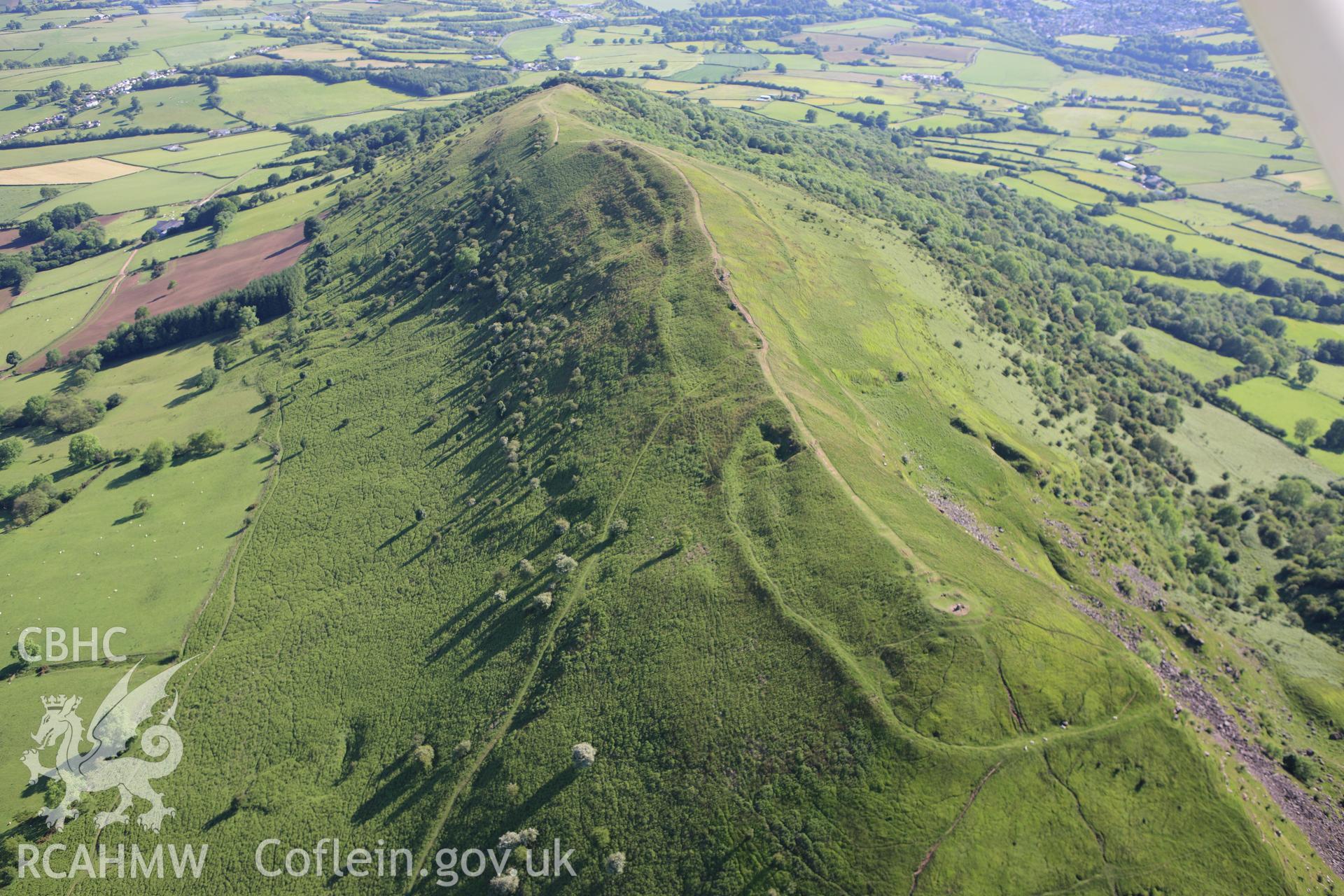 RCAHMW colour oblique aerial photograph of Skirrid Fawr Summit Enclosure. Taken on 11 June 2009 by Toby Driver