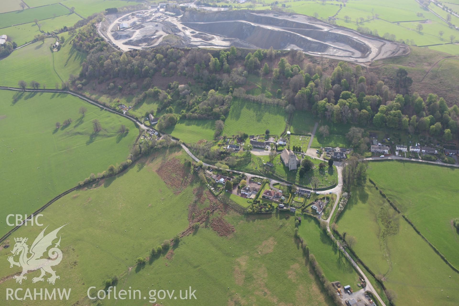 RCAHMW colour oblique aerial photograph of St Stephen's Church, Old Radnor, and the village. Taken on 21 April 2009 by Toby Driver