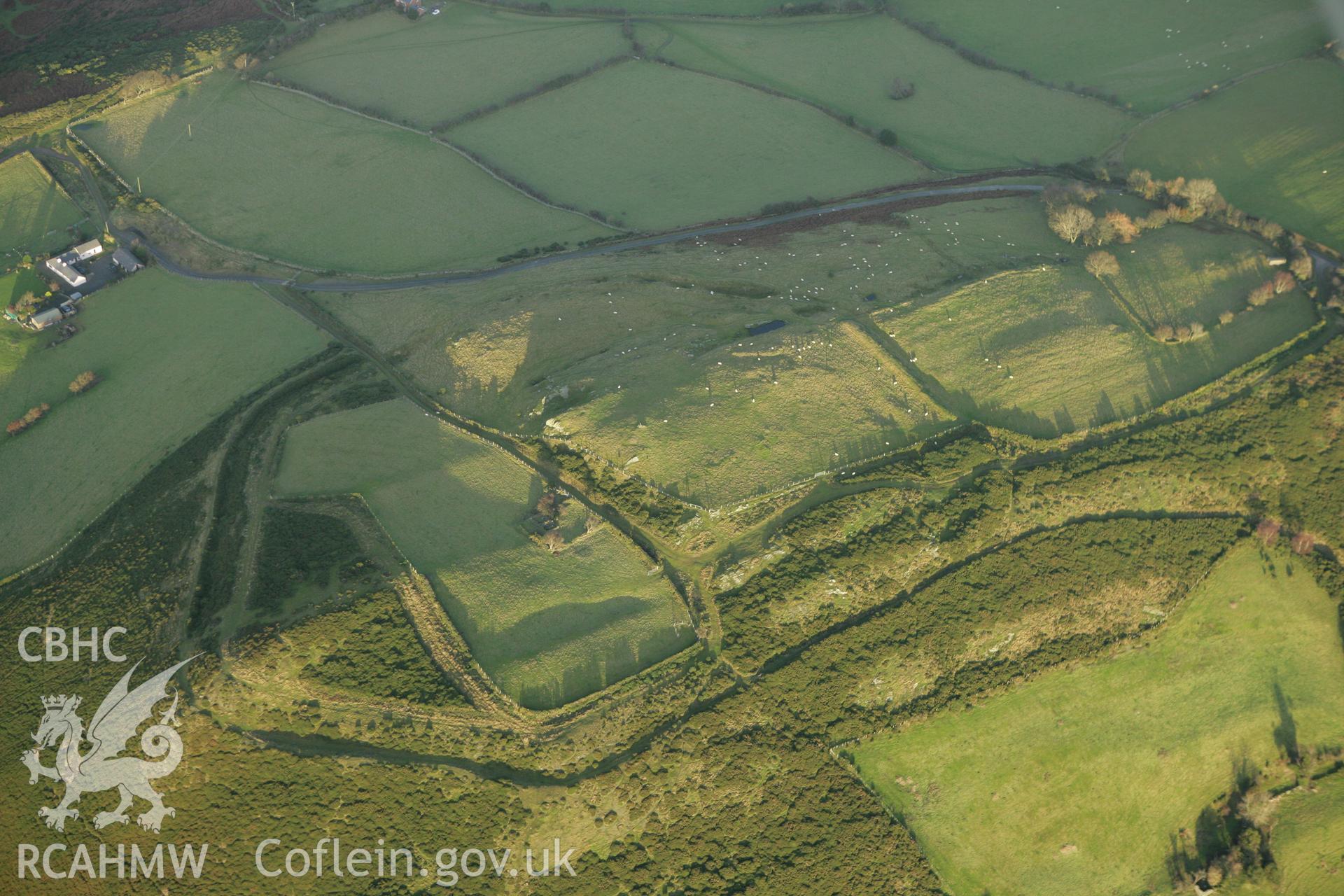 RCAHMW colour oblique aerial photograph of Mynydd y Gaer Hillfort. Taken on 10 December 2009 by Toby Driver