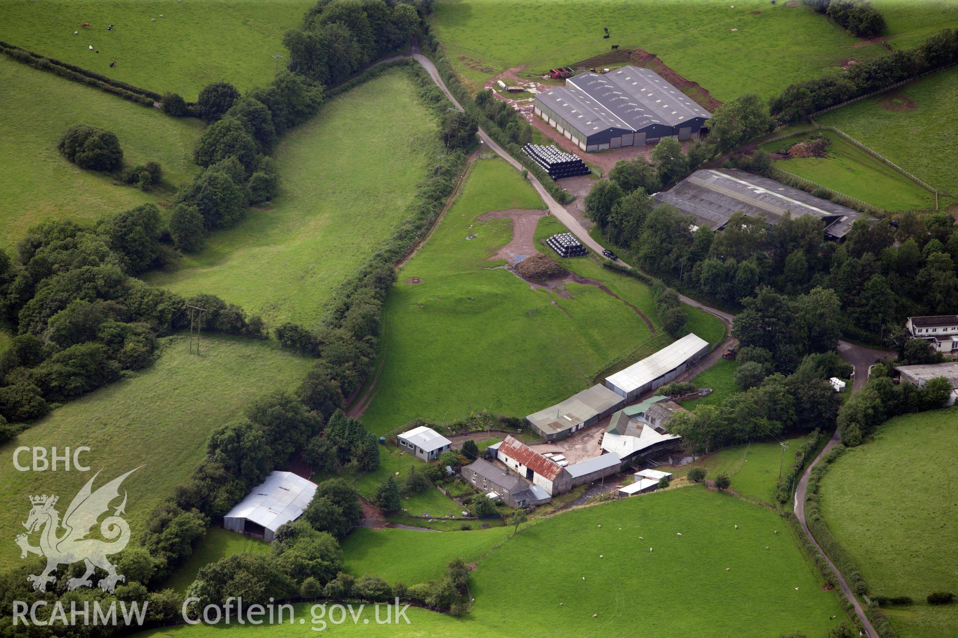 RCAHMW colour oblique aerial photograph of Ty-Isaf Chambered Cairn. Taken on 23 July 2009 by Toby Driver