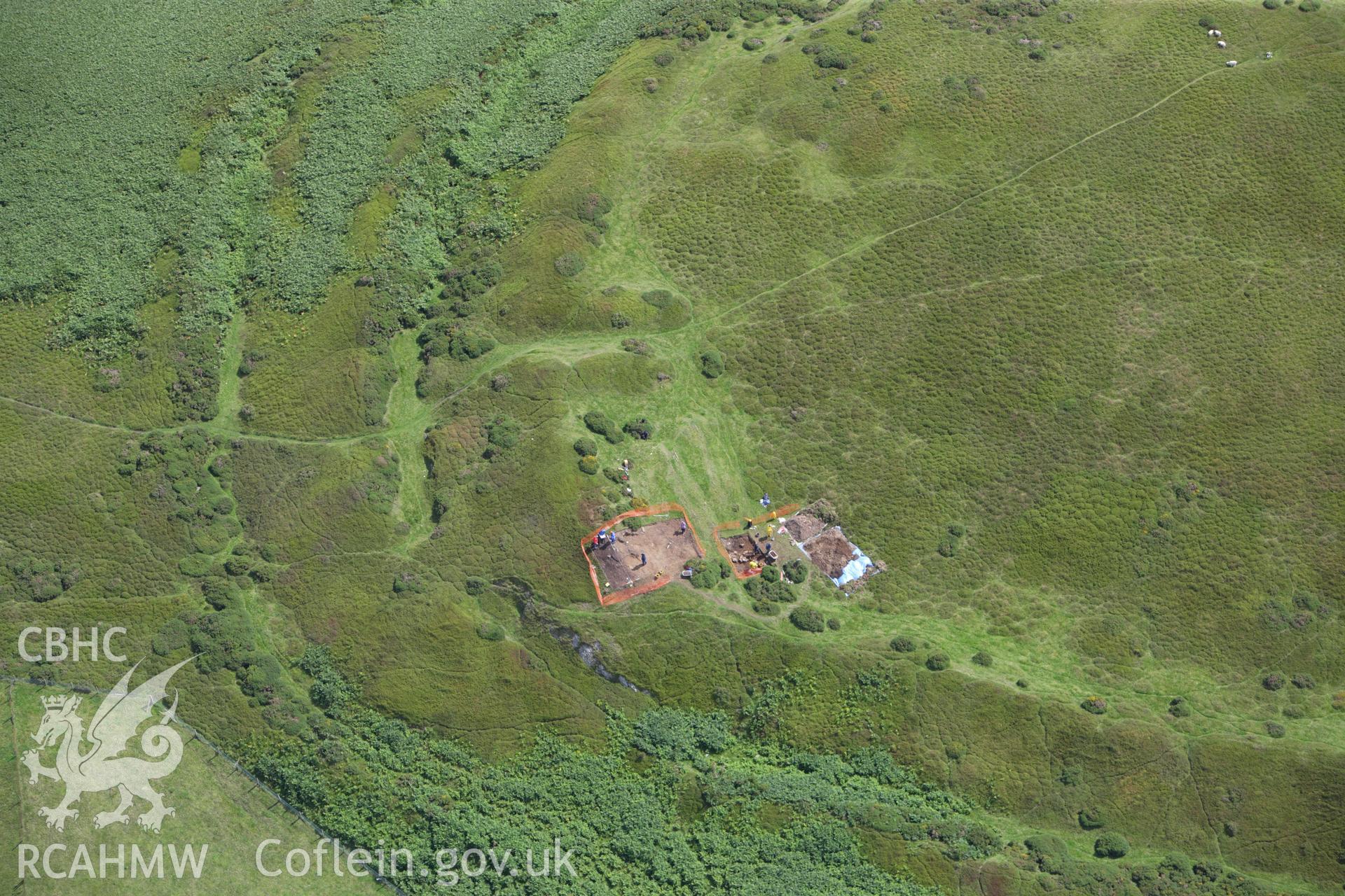 RCAHMW colour oblique aerial photograph of Moel-y-Gaer Hillfort, Llanbedr, with Bangor University excavations. Taken on 30 July 2009 by Toby Driver