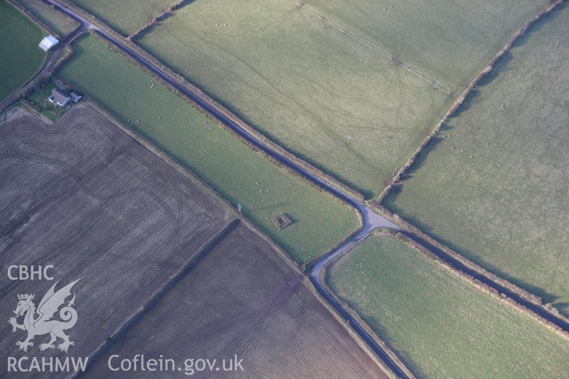 RCAHMW colour oblique photograph of Llansadurnen Cross-incised stone and other stones. Taken by Toby Driver on 11/02/2009.