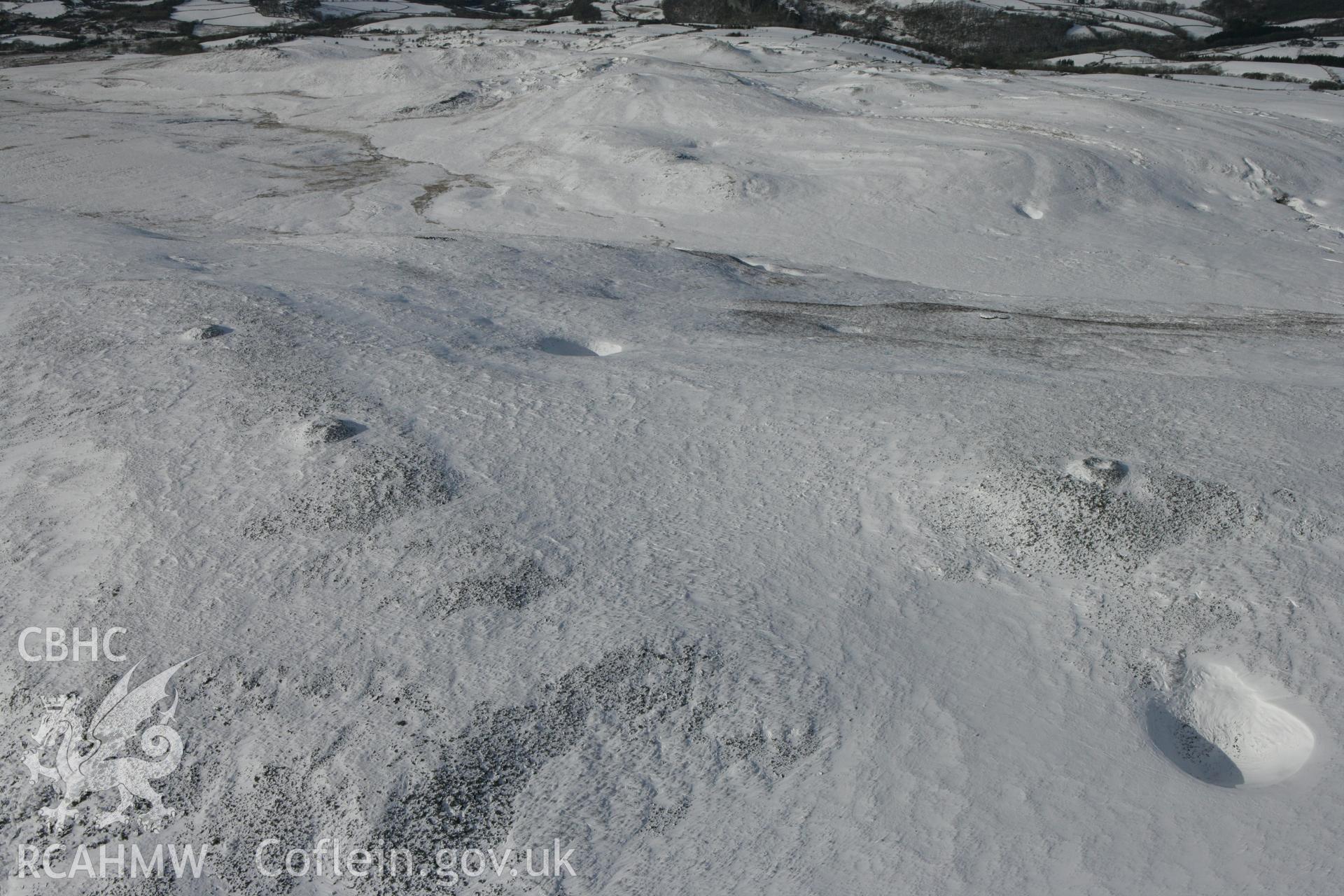 RCAHMW colour oblique photograph of Tair Carn Isaf, cairns. Taken by Toby Driver on 06/02/2009.