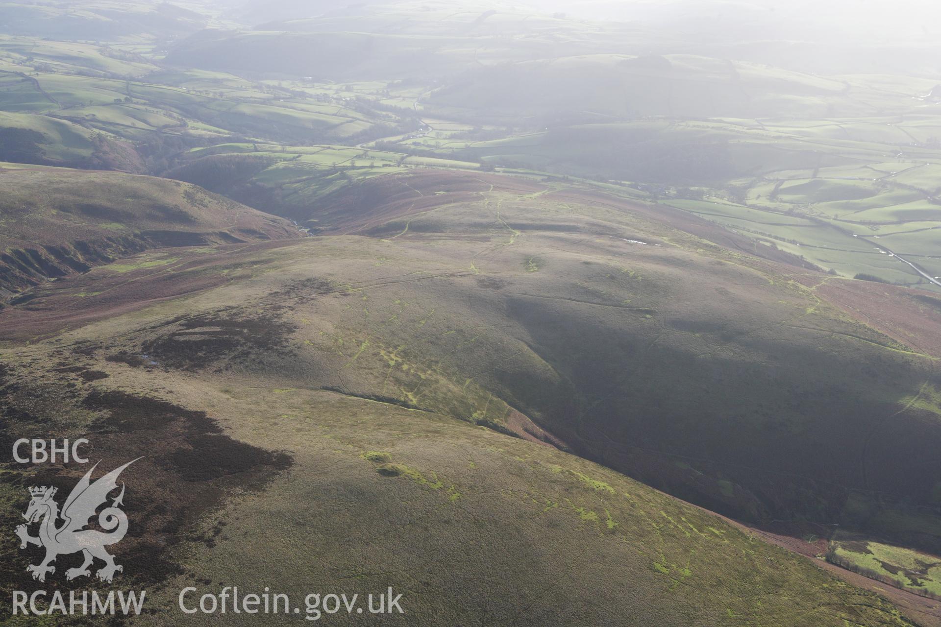 RCAHMW colour oblique aerial photograph of Rhos Crug Barrow II. Taken on 10 December 2009 by Toby Driver