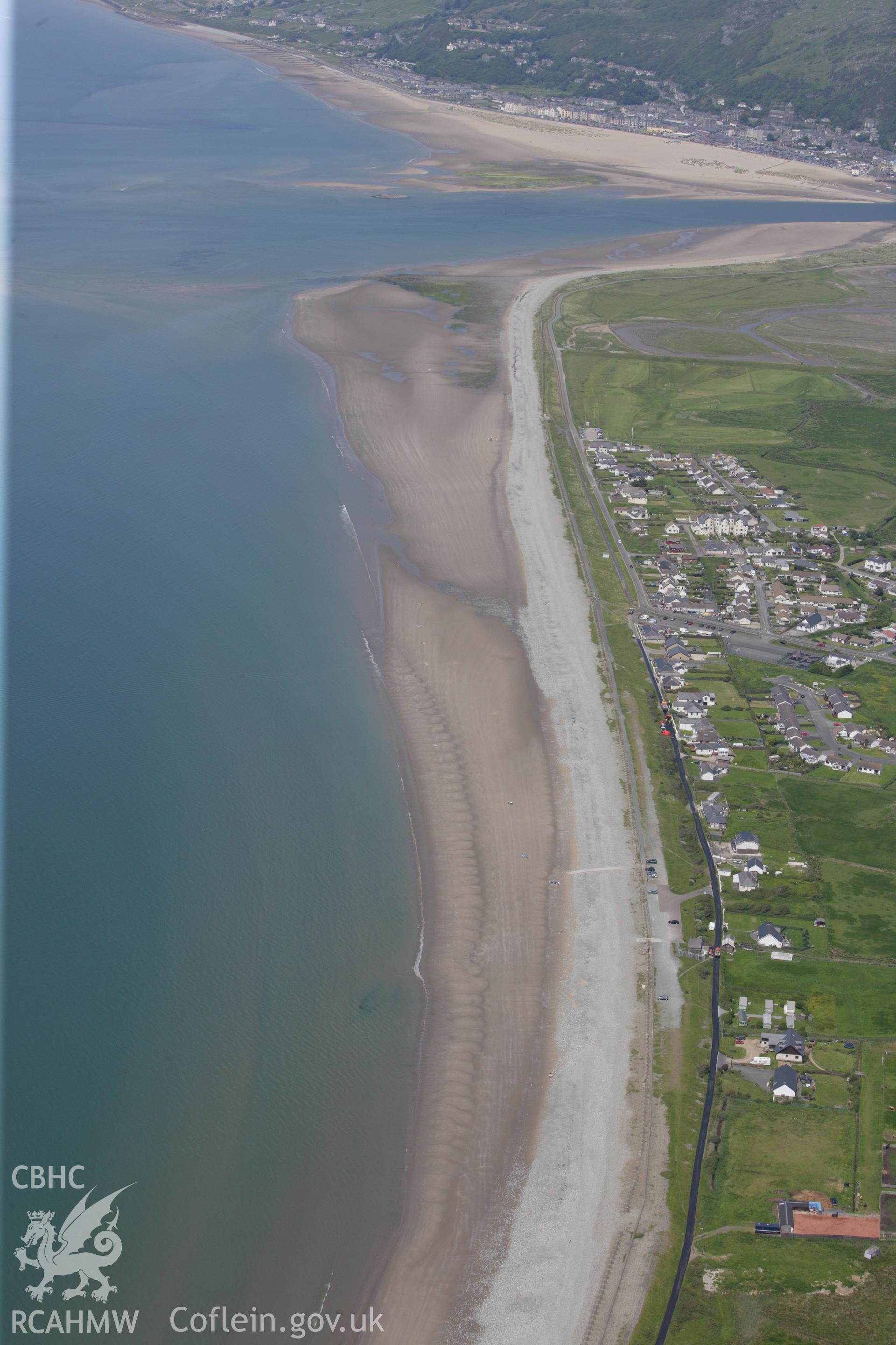 RCAHMW colour oblique aerial photograph of Fairbourne showing the beach.. Taken on 02 June 2009 by Toby Driver